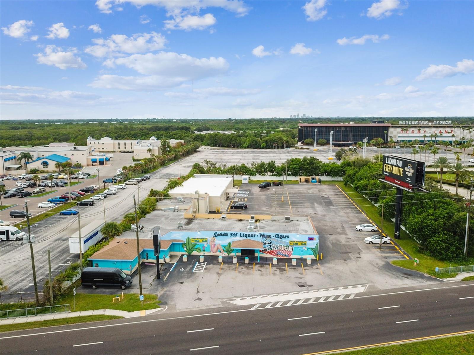 Rare opportunity to own 1.5 acres MOL prime commercial property on Gandy Blvd situated in unincorporated Pinellas County. Currently a full-service liquor/package store and gentlemen's club with full kitchen. Take over current operations OR take advantage of new opportunities and countless development and/or business possibilities with the existing 17,000 MOL sq. ft. bock building w/ two separate main entrances and addresses OR opportunity to develop and build up. Sale includes real estate AND 4 COP liquor license; Inventory and FF&E negotiable. Extra income from Clearchannel billboard lease. Property underwent recent renovations/remodel/upgrades. Approx. 100 parking spaces. Prime location on Gandy Blvd.
