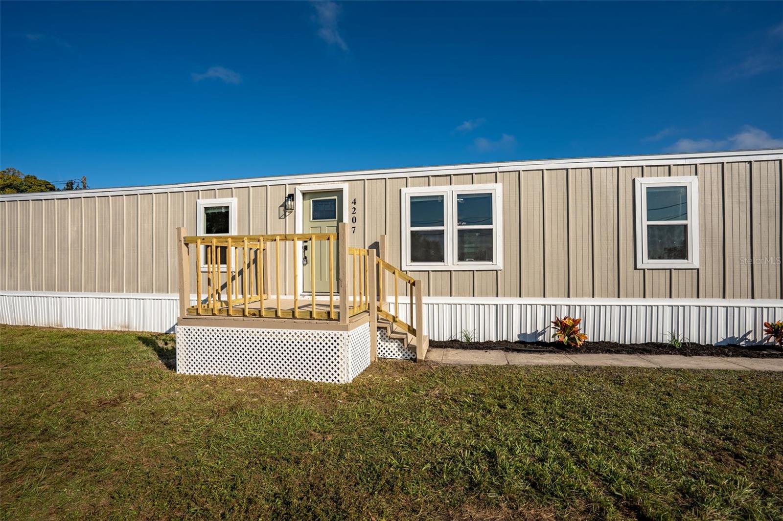 Welcome to this fully remodeled double-wide mobile home in the heart of Lakeland! This charming 3-bedroom, 2-bathroom home sits on a spacious corner lot, that’s almost 1 acre! Walk into a very spacious open floor plan with luxury vinyl plank flooring throughout. The home boasts a brand-new roof, updated plumbing, and modern fixtures in almost every room. The kitchen is a chef’s dream with quartz countertops and an island over looking the large living area (which makes it perfect for entertainment). The master bathroom offers both a spa tub and a stand-up shower. Each bedroom comes with ceiling fans and walk-in closets for added comfort and storage.Enjoy this large living and just imagine the possibilities you can create with the additional yard space! Even better? It’s located almost 10 minutes from shopping centers and restaurants, this home boasts both comfort and modern living.