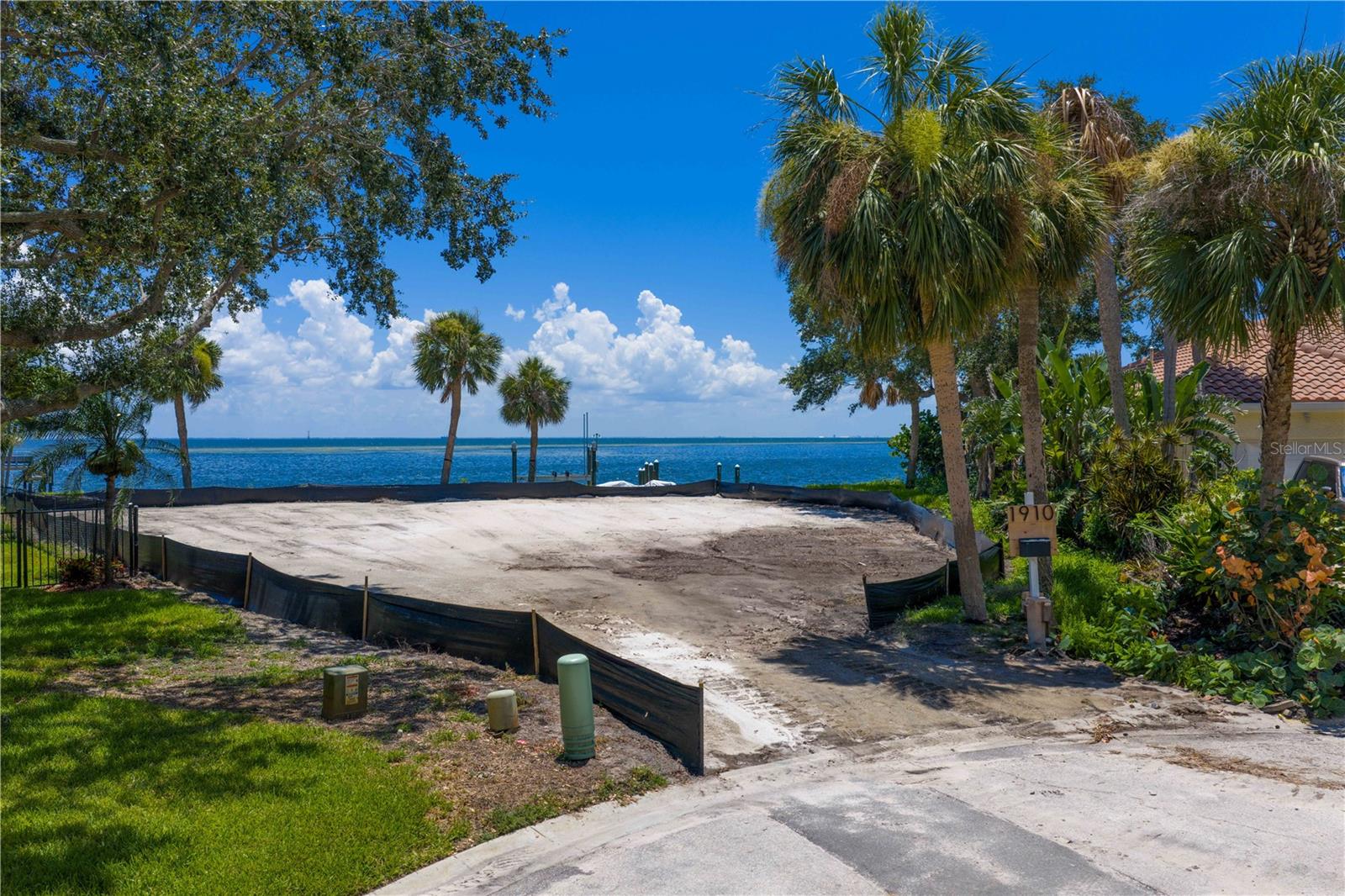 Discover your own slice of paradise with this rare OPEN WATERFRONT LOT on a quiet cul-de-sac in the coveted Venetian Isles neighborhood! Boasting 140 ft of panoramic waterfront views of downtown St. Petersburg, the iconic Skyway Bridge, and both stunning sunrises and breathtaking sunsets, this prime location offers the ultimate Florida lifestyle. Imagine building your dream home on this generous lot complete with an updated Sea Wall, a 2023 Boat Lift, and direct deep water access - ideal for boating, fishing, or simply soaking in the beautiful Gulf breezes. Immerse yourself in the dynamic open water scenery and the tranquil sounds of the water right in your backyard. Venetian Isles is a highly sought-after neighborhood known for its upscale homes, welcoming Golf-Cart-Friendly Community, and close proximity to the best of St. Petersburg's shopping, dining, and cultural attractions. Whether you envision building a luxurious estate, a modern retreat, or a classic coastal sanctuary, this lot offers an unparalleled canvas for your vision. Don't miss this rare opportunity to own a piece of waterfront paradise with some of the best views on Florida's Gulf Coast.