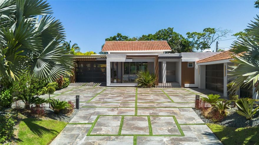 Welcome to 135 Dorado Beach East, where sleek design meets elevated island living in one of Puerto Rico’s most exclusive gated communities. Fully reimagined, expanded, and meticulously renovated, this one-story residence maximizes its generous 1,164 square meter lot to deliver a home that’s as functional as it is breathtaking. With 3,707 square feet of interior air-conditioned space and a total construction footprint of 6,607 square feet, this property offers both scale and style.
Step inside to an airy, open-concept layout designed for seamless entertaining and relaxed luxury. At the heart of the home is a state-of-the-art chef’s kitchen, outfitted with top-tier appliances and custom finishes. The main house features four spacious bedrooms and four spa-inspired bathrooms, including a serene primary suite with soaring ceilings, double showers, soaking tub, dual vanities, and a walk-in closet built for a true retreat. A private TV lounge adds flexibility and comfort to the well-thought-out floor plan.
Outside, your personal resort-style oasis awaits. A sprawling terrace anchors the beautifully landscaped backyard, featuring a full outdoor kitchen, gas fire pit, and a massive lap-style pool with integrated hot tub. There’s also a dedicated full outdoor bathroom, enhancing convenience for poolside living and entertaining.
In addition to the main residence, the home includes a separate guest casita with a full bathroom and kitchenette—perfect for extended stays or added privacy. A two-car garage, a golf cart garage, and an extended covered terrace that doubles as additional covered parking for flexibility, functionality, and thoughtful use of space. Located at the end of a quiet street, the setting provides rare privacy within the community.
And beyond the home itself lies something truly special: access to the world-class Dorado Beach lifestyle. As a resident of Dorado Beach East, you’re eligible for membership at the exclusive Dorado Beach Resort & Club—home to championship golf courses designed by Robert Trent Jones Jr., five-star dining, the iconic Encanto Beach Club, the Watermill aquatic park, Spa Botánico, tennis and pickleball facilities, and miles of walking and biking trails. It’s more than a home—it’s your gateway to one of the most coveted resort communities in the Caribbean.
Offered at an exceptional value, 135 Dorado Beach East is a rare opportunity to own a beautifully redesigned home in one of the most sought-after resort communities in the Caribbean.