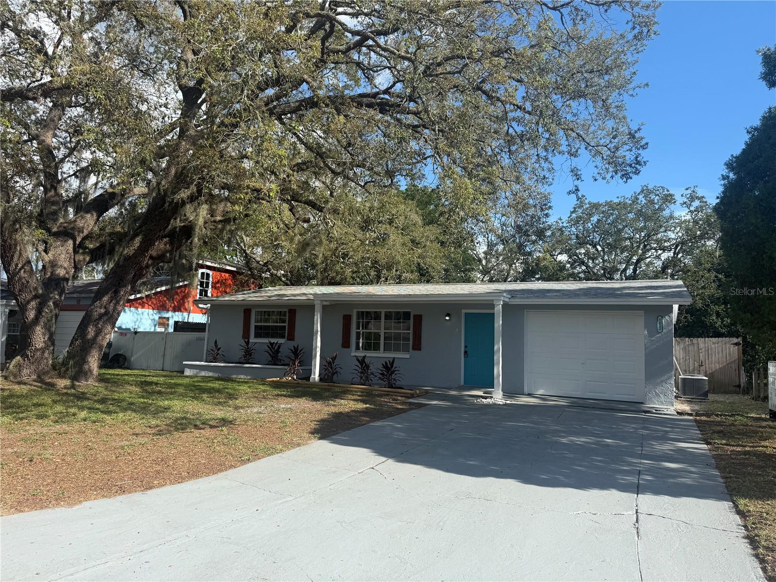 Recently renovated 2 bedroom, 1 bath home with a huge screened in pool, a garage and fenced yard in desirable Holiday. This home boasts tons of recent updates. Brand new kitchen cabinets with new quartz countertops, new backsplash and new stainless steel appliances. New luxury vinyl plank throughout the property for easy maintenance. New paint inside and out, new modern lighting and ceiling fans, new 6 panel doors, new hot water heater and an updated bathroom along with newer energy efficient vinyl windows. As you enter the front door, you will be greeted by the spacious living room which transitions to a dinette area off the kitchen that features brand new stainless steel appliances. A 30 year dimensional shingle roof was installed 2022 and a new central HVAC 2017, so your major ticket items are taken care of for many years. You have laundry hookups in the garage. Outside you have a nice sized yard out front and you can enjoy your days and evenings in the large fenced backyard as you cool off in the inground pool! The property is located in desirable Holiday Lakes and is just minutes from great restaurants, plenty of shopping, and several beautiful parks and a quick ride to Tampa or the beaches! There is NO HOA, NO Deed Restrictions, and NO Flood Insurance required and has a clean wind mitigation report and 4 point inspection. This home would be great for a 1st time buyer, vacation home, or even move-in ready rental home! Buyer to verify all room sizes.
