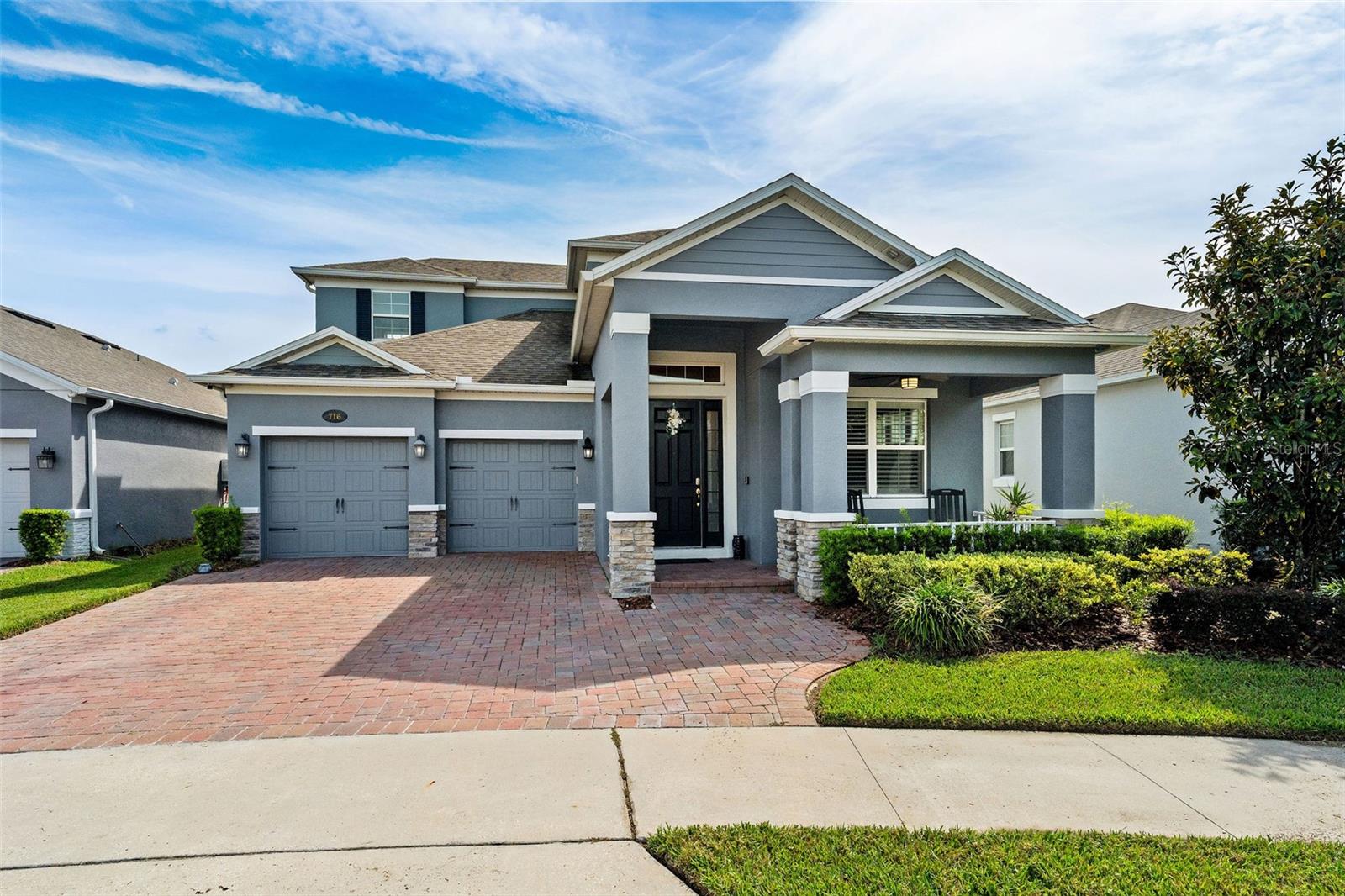 Built in 2019, this stunning 4-bedroom, 3.5-bathroom residence combines timeless craftsmanship with modern sophistication in one of Winter Garden’s most desirable locations. Offering over 3,100 square feet of thoughtfully designed living space, this home pairs elegant interior finishes with extensive upgrades that make everyday living both effortless and refined.
Step inside to find custom interior shutters, crown molding, and enhanced trimwork throughout, setting a tone of understated luxury. The chef’s kitchen impresses with double ovens, a gas cooktop, and a spacious layout that seamlessly connects to the open family room—complete with a custom-built entertainment center and cabinetry. Upstairs, the loft features a custom wet bar with built-in cabinetry, lighting, and sink—an ideal space for entertaining or relaxing at the end of the day.
Retreat to the primary suite, where automatic blinds, a custom closet system, and a serene ensuite bath create a true sanctuary. Each bedroom includes customized storage, reflecting thoughtful attention to detail throughout the home.
Outdoor living is equally remarkable: a fully equipped outdoor kitchen with kegerator, natural gas fire pit, outdoor shower, and motorized screens make this space perfect for year-round enjoyment. The custom second-floor porch adds an elevated retreat overlooking the property.
Practical features abound, including a whole-home generator (serviced annually), saltwater and carbon filtration system, gas tankless water heater, new dishwasher and disposal, and metal shelving in the garage for optimized storage. Even exterior details—like added outlets for holiday lighting—reflect the home’s careful design.
This property has been meticulously maintained, with biannual HVAC servicing, monthly pest control, a subterranean termite bond, annual generator and backflow servicing, and more—all ensuring peace of mind and long-term value.
The neighborhood offers a beautiful community pool, just a short walk from the property. It is golf-cart friendly, too! Located just steps from the West Orange Trail, this home offers convenient access to historic Downtown Winter Garden, local shops, dining, and top-rated schools including Dillard Street Elementary, Lakeview Middle, and West Orange High.