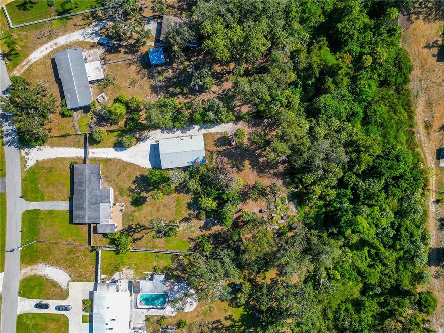 $25K price improvement with a motivated seller!! Discover the perfect blend of country charm, in-town convenience, and unmatched versatility with this rare 3-bedroom, 2-bath with an office ranch-style home situated on an impressive 1.25 acres. Offering 1,568 square feet of comfortable living space, this property is perfect for anyone seeking room to spread out—whether for personal enjoyment, business needs, or both—without sacrificing quick access to town amenities.

With its A-1 zoning and excellent intown location, the property is also well suited for light commercial use such as equipment storage, trailer storage, or space for a small business needing land and a secure base of operations. The impressive 30' x 48' pole barn, set on a concrete slab and equipped with electricity, is ready for workshops, business inventory, vehicle storage, or any project you can imagine.

Inside, you’ll enjoy upgraded luxury vinyl plank flooring throughout, a beautifully remodeled primary bathroom, and an enlarged walk-in closet for the primary suite. The flexible floor plan provides even more room to live and work, featuring an inviting office/den, a bright Florida room, and a screened-in patio ideal for quiet mornings, hobby space, or hosting friends and family.

Step outside to fully appreciate what makes this property truly exceptional: the land and its endless potential. Zoned A-1 agricultural, this fully fenced parcel—with an automatic gate opener—offers incredible freedom for a wide range of uses. Whether you envision gardening, outdoor living areas, raising animals, recreational space, or expansive personal storage, the acreage provides the canvas to bring your ideas to life.

Whether you're drawn to the acreage, the privacy, the potential to expand your lifestyle, or the opportunity to support a business, this property offers a rare chance to enjoy the best of both worlds—open space paired with small-town ease. A must-see for anyone looking for room to grow, create, or operate with flexibility.