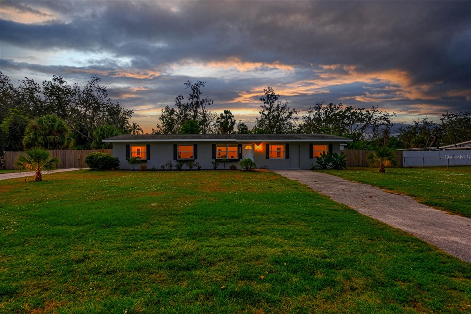 Discover the perfect blend of country charm and in-town convenience with this rare 3-bedroom, 2-bath ranch-style home nestled on 1.25 acres. Offering 1,568 square feet of comfortable living space, this property is ideal for those seeking room to spread out without sacrificing proximity to town amenities.
Inside, you’ll find upgraded luxury vinyl plank flooring throughout, a beautifully remodeled primary bathroom, and an enlarged walk-in closet for the primary suite. The flexible floor plan includes an inviting office/den, a bright Florida room, and a screened-in patio—perfect for enjoying quiet mornings or entertaining guests.
Step outside to appreciate what truly sets this property apart: the land. Zoned agricultural and fenced with an automatic gate opener, this spacious lot provides endless opportunities for hobbies, gardening, animals, or additional storage. The impressive 30' x 48' pole barn sits on a concrete slab and comes equipped with electricity, ready to accommodate all your projects, equipment, or recreational vehicles.
Whether you’re drawn by the acreage, the privacy, or the versatile outbuildings, this property offers a rare opportunity to enjoy the best of both worlds—open space and small-town convenience. A must-see for anyone seeking a peaceful lifestyle with room to grow!