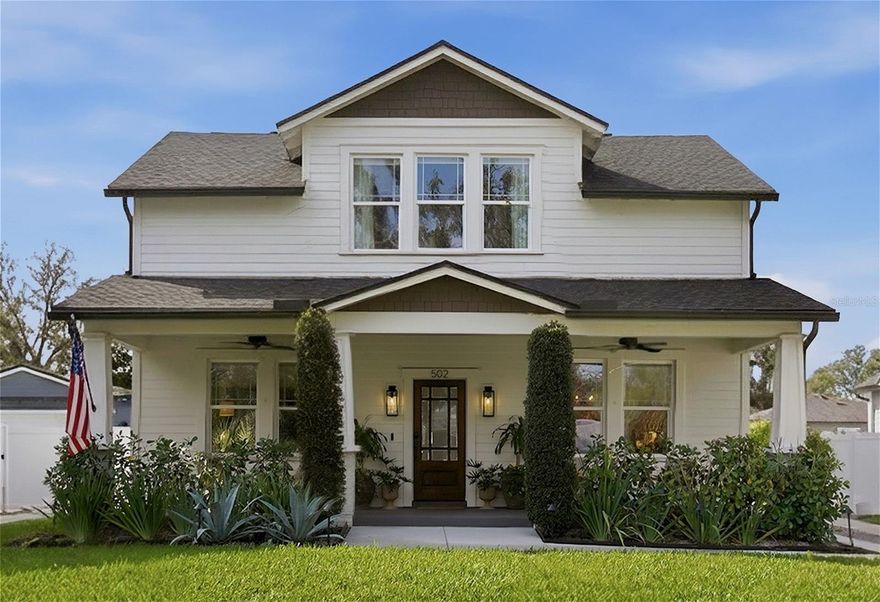 Welcome to 502 W North Bay Street — a beautifully crafted 2,302 sq ft custom home built in 2020, located in the heart of Tampa’s highly sought-after South Seminole Heights neighborhood. This 3-bedroom, 3-bathroom two-story residence perfectly blends modern construction with warm, curated finishes throughout, all set along one of Tampa’s most vibrant and desirable corridors.

From the moment you arrive, the home’s charming curb appeal makes a lasting impression. Lush landscaping frames the white Hardie lap siding exterior, complemented by a stained wood front door, black statement sconces, and a welcoming front patio ideal for morning coffee or evening relaxation.

Inside, the open main level showcases rich bamboo wood flooring, crown molding, custom window treatments, designer lighting, and an abundance of natural light. The living and dining areas flow seamlessly into the showpiece kitchen, thoughtfully designed with white shaker cabinetry, brass hardware, quartz countertops, a classic subway tile backsplash, KitchenAid appliances, a built-in wine rack, and a spacious peninsula with bar seating. A custom marble-topped island anchors the space, while a walk-in pantry provides ample storage. French doors off the kitchen lead directly to the backyard, creating effortless indoor-outdoor living.

The main floor also includes a well-appointed guest bedroom with closet and a full bathroom featuring a double vanity and tub/shower combination.

Upstairs, the oversized primary suite offers a true retreat, complete with generous proportions and elegant crown molding. The primary bathroom features dual vanities, a freestanding clawfoot tub, a large walk-in shower, and a private water closet. Just beyond, the custom primary closet includes built-in storage and an additional storage closet for added functionality.

The second upstairs bedroom features its own private en-suite bathroom and spacious walk-in closet, ideal for guests or multigenerational living. A full-size laundry room with side-by-side Electrolux washer and dryer, plus built-in cabinetry, completes the upper level.

Outside, the fully paved backyard is designed for entertaining, featuring upgraded landscaping and a covered pergola with ceiling lights and a fan. The detached garage is currently outfitted as a private, air-conditioned home gym, offering flexible use for fitness, workspace, or additional storage.

Located just minutes from Downtown Tampa, Armature Works, the Riverwalk, Raymond James Stadium, and Tampa International Airport, this home also provides easy access to some of the city’s best dining, breweries, and entertainment — all while enjoying the tree-lined charm and character that make Seminole Heights one of Tampa’s most beloved neighborhoods.