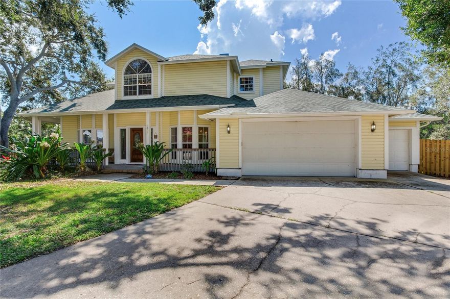 STUNNING 4-BEDROOM, 3-BATH POOL HOME ON A PRIVATE CUL-DE-SAC  Welcome to 1851 Juanita Ct, a stunning and spacious two-story home tucked away on a quiet cul-de-sac in the heart of Clearwater. This beautifully updated 4-bedroom, 3-bath residence offers over 2,800 square feet of living space and is perfectly designed for comfort, style, and entertaining. Set on an oversized lot with no rear neighbors and surrounded by mature trees, the home provides rare privacy and a peaceful natural backdrop. Step inside to find soaring ceilings, wood-look flooring throughout, abundant natural light, and new windows that enhance both beauty and efficiency throughout the home. The open-concept layout features a formal living room and dining area with elegant lighting. The fully renovated kitchen is a true showpiece, equipped with soft-close shaker cabinetry, granite countertops, stainless steel appliances, double ovens, a designer backsplash, and a large center island. The sunny breakfast nook overlooks the expansive backyard and sparkling pool, creating the perfect setting for morning coffee or casual dining. The first floor also includes a full guest bedroom and bathroom, ideal for a home office or in-law suite, along with multiple living areas and a well-appointed laundry room with custom cabinetry. Upstairs, the luxurious primary suite impresses with vaulted ceilings, triple bay windows, a sitting area, and private French doors leading to a large covered balcony with serene views of the trees and water beyond. The primary bath offers a spa-like experience with a jetted tub, custom tile walk-in shower, and an expansive walk-in closet. Two additional upstairs bedrooms feature ample closet space, sliders, and access to the wraparound balcony. The thoughtful layout also includes a bonus flex room and an oversized three-car garage with additional storage. Outdoors, the fully fenced backyard is a private oasis with a generous pool deck, lush lawn, and direct views of the creek and peaceful wooded preserve. Combining exceptional value with unmatched character and functionality, this move-in-ready home is located just minutes from Clearwater Beach, downtown Dunedin, top-rated schools, shopping, and dining.