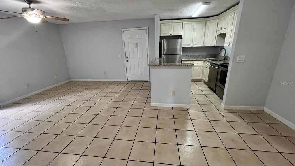 Photo of 2740 Oak Park Way #102, Orlando, FL 32822 (MLS # O6449700)