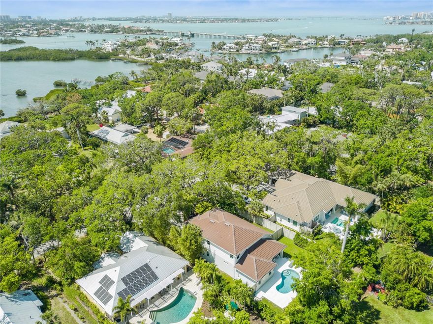 Oversized lot, Newly Built, Granada & Red Rock Park

Discover the ultimate blend of location, luxury, and lifestyle in this exquisite custom home, built in 2021 in the heart of it all . Set on an oversized 13,000+ sq. ft. lot in a peaceful, tree-lined cul-de-sac, this architectural masterpiece offers privacy and tranquility.
Boasting four bedrooms, including two owner’s suites, and 3.5 baths, this thoughtfully designed residence embodies effortless elegance. The primary owner’s suite on the main level opens seamlessly to the private pool and lush backyard, while the second owner’s suite upstairs features a spa-inspired marble walk-in shower. Two additional bedrooms share a stylish Jack and Jill bath, each with custom-built closets and abundant natural light.

Step inside to a soaring entryway with vaulted shiplap ceilings, wide-plank wood flooring, and expansive hurricane-impact windows and sliding glass doors, inviting the outdoors in. The open-concept living area is perfect for entertaining, flowing into a chef’s dream kitchen with a massive island, generous counter space, and premium finishes.

Surrounded by lush landscaping and a fenced backyard oasis, this home is designed for seamless indoor-outdoor living. An extraordinary opportunity to own a new coastal contemporary gem in one of Sarasota’s most desirable locations, just moments from Siesta Key, The Field Club, Oyster Bay, and Southside Village.