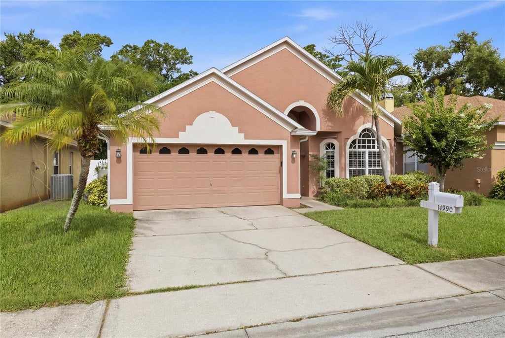 Photo of 14990 Hidden Oaks Circle, Clearwater, FL 33764 (MLS # TB8511243)