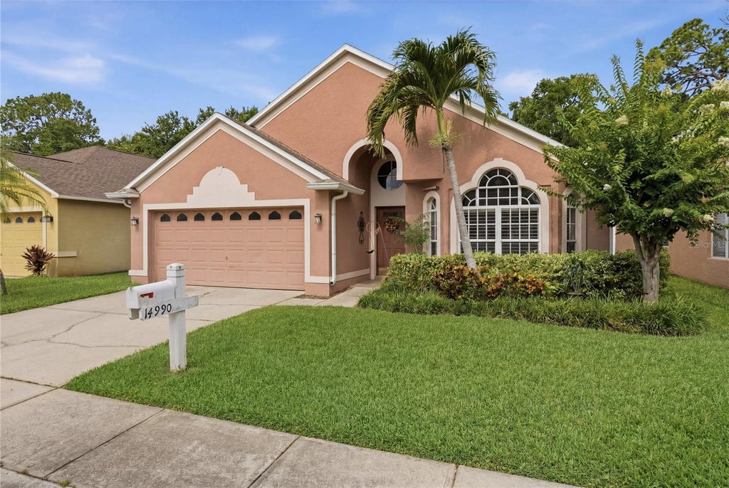 Photo of 14990 Hidden Oaks Circle, Clearwater, FL 33764 (MLS # TB8511243)