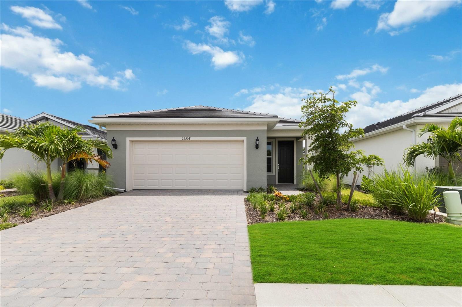 Discover this new gated community on Manasota Key, where resort-style living awaits! With the beach, dining, and shopping close by—and the clubhouse practically at your doorstep—you’ll enjoy a true vacation lifestyle.
This Hallmark floor plan offers 1,655 square feet under air with 3 bedrooms, 2 bathrooms, a 2-car garage with epoxy flooring, and a screened lanai perfect for enjoying your morning coffee. The garage is also equipped with a 220-volt outlet, ready for your electric vehicle.
Step inside to an open-concept layout designed for both everyday living and entertaining. Expansive windows fill the home with natural light, creating a bright and welcoming atmosphere. The gourmet kitchen features stainless steel appliances, a slide-in gas range, 42" white cabinets, quartz countertops, and a marble tile backsplash. Additional upgrades include impact windows, 5 1/4" baseboards, luxury vinyl plank flooring throughout, and ceramic tile in the bathrooms and laundry room.
The community offers an unmatched lifestyle with a tropical saltwater pool and heated spa, a state-of-the-art fitness center, two movement studios, card rooms, outdoor terraces with fire pits, bocce ball, pickleball, tennis courts, scenic lakeside walkways, a dog park, community garden, and miles of trails. A full-time activities director curates a lively social calendar, making it easy to connect with neighbors. Plus, enjoy dining at the brand-new Waterline Restaurant or the High Tide Bar & Grill, both offering indoor and outdoor seating.