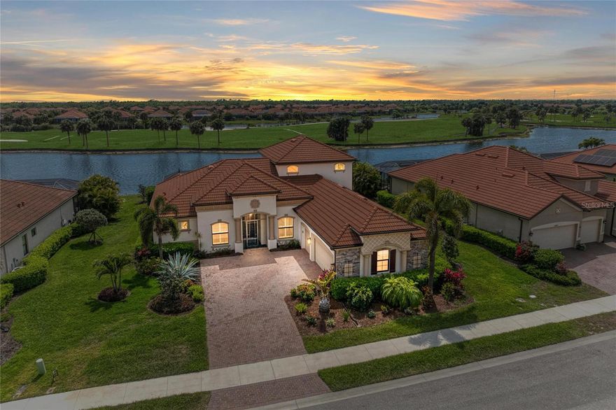 Welcome to one of the most desirable homes in Sarasota National’s estate section—where refined design, breathtaking golf course views, and effortless indoor-outdoor living come together in perfect harmony.

Ideally positioned mid-street on a quiet cul-de-sac, this Napoli Grande residence with pool and spa captures sweeping long fairway views of the 2nd hole, paired with coveted southwestern exposure. The result is a home filled with warm, natural light by day and unforgettable sunset evenings that unfold over your private pool and spa—an ever-changing backdrop of color and calm.

Inside, every detail has been thoughtfully elevated. Custom trim work and coffered ceilings bring architectural richness and warmth to the main living spaces, while the open-concept design creates a natural flow that feels both inviting and expansive. The kitchen and great room transition seamlessly to the lanai, blurring the lines between indoors and out—perfect for entertaining or simply enjoying the rhythm of everyday living.

Designed to truly embrace Florida’s indoor-outdoor lifestyle, disappearing sliding glass doors—along with additional access from the breakfast nook and primary suite—open to a spectacular screened lanai. Here, a sparkling pool and spa are surrounded by a serene tropical setting, all enhanced by those sought-after southwestern sunset views that elevate every moment.

The outdoor space has been beautifully reimagined with a light, modern stone pool deck, offering a clean, sophisticated aesthetic that complements the natural surroundings. A covered lanai with wood ceiling detail creates the ideal setting for morning coffee, relaxed afternoons, or evenings spent gathering with friends as the sun dips below the fairway.

Upstairs, a spacious bonus suite with a full bath, bar area, sink, and wine refrigerator offers incredible flexibility—whether as a private guest retreat, media room, or an elevated entertaining space.

Additional features include hurricane-rated windows and doors, Storm Smart protection for the lanai, and a 3-car garage—blending peace of mind with everyday convenience. This home also includes a coveted golf membership, offering immediate access to Sarasota National’s championship course—an exceptional value and lifestyle advantage.

As a resident, you’ll enjoy resort-style amenities including golf, dining, fitness, and a vibrant, connected social atmosphere. The golf course is currently undergoing a renovation to bring you a new and improved golfing experience.  Perfectly located near multiple golf courses and just minutes from Wellen Park, with easy access to Englewood Beach, Venice Beach, Siesta Key, and the natural beauty of Myakka River State Park.

This is more than a home—it’s a lifestyle defined by comfort, elegance, optional activities and connection.
Come see, come sigh… and make this extraordinary residence your own.