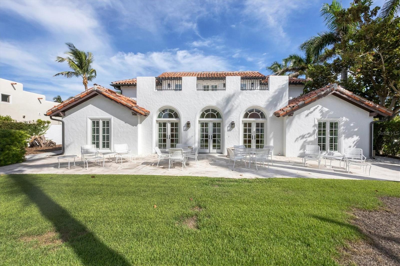 Weekly rate shown, please see the end of the description for detailed pricing.
Boca Grande’s iconic charm is beautifully reflected in this five-bedroom residence, ideally positioned across from the historic Johann Fust Library with convenient beach access just beyond the front door. Its premier location within the Historic District also places you just a short distance to boutique shops, fine dining, and the cultural heart of downtown.
Thoughtfully updated, the home blends timeless architecture with modern comfort. Two spacious primary bedrooms upstairs each feature king beds and elegantly appointed en-suite baths. The first level offers a third king bedroom, a queen bedroom, and double twin bedroom, all designed with comfort and style in mind. With five full bathrooms and powder room, the layout ensures both privacy and flexibility for larger groups.
At the heart of the home, the fully renovated kitchen showcases high-end appliances, a built-in ice maker, and generous counter space for effortless entertaining. Both formal and casual dining and living rooms provide inviting spaces for gathering, while rooftop decks capture panoramic views and give a perfect setting to watch Boca Grande’s renowned sunsets.
The outdoor living areas enhance the island experience, from relaxed afternoons on the porches to evenings under the stars. Every detail has been carefully considered to create a home that is equally suited for quiet retreat or lively entertaining.
Please note, parking for the residence is within public parking areas, and availability may be limited.
This exceptional property combines location, luxury, and lifestyle, offering a rare opportunity to experience the very best of Boca Grande’s coastal living.
Off-season: $5650 weekly/$24210 monthly
Mid-season: $6500 weekly/$27870 monthly
In-season: $7100 weekly/$30450 monthly