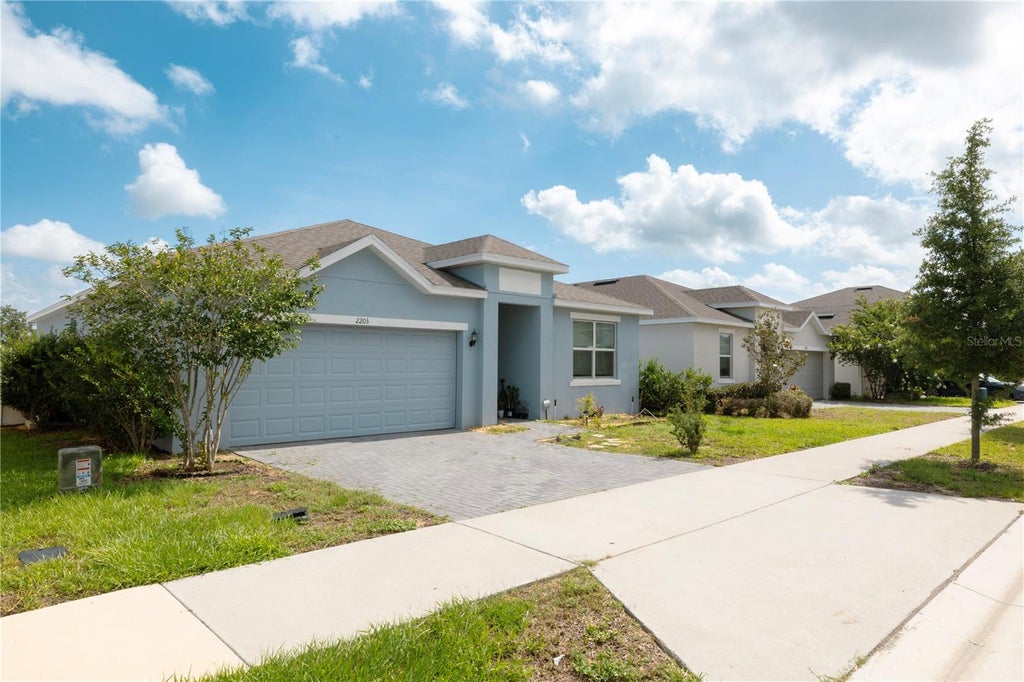 Photo of 2203 Pigeon Plum Drive, Haines City, FL 33844 (MLS # O6411185)