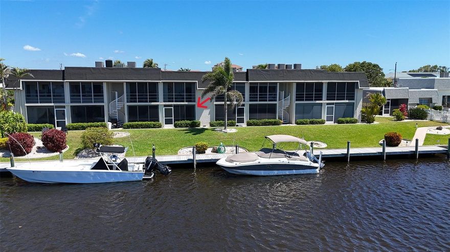 One or more photo(s) has been virtually staged. HUGE PRICE ADJUSTMENT!!! WATERFRONT LIVING AT ITS FINEST WITH THE BEST VIEWS! RENOVATED FIRST-FLOOR CONDO IN THE ANCHORAGE. Sailboat access, 200’ wide canals, and minutes to open water! Welcome to The Anchorage, a hidden gem in Southeast Cape Coral offering 800+ feet of prime waterfront, a community boat dock, and a fishing pier—perfect for boaters, kayakers, and anyone who loves being on the water! This 55+ community is situated just off the coveted Beach Parkway area, a short stroll from the soon-to-be revitalized Jaycee Park along the Caloosahatchee River. This completely renovated 2-bedroom, 2-bathroom first-floor condo is a true showstopper. With 1,117 square feet of thoughtfully designed space, it offers stylish laminate flooring throughout, a bright and airy layout, and a spacious screened-in lanai with hurricane-rated sliders (coming soon!) and ample storage. Step outside and take in the stunning canal and dock views, where you can watch boats cruise by and dolphins play right from your own backyard. The kitchen features modern cabinetry, sleek granite countertops, and stainless steel appliances, while the updated bathrooms boast contemporary finishes. The primary suite offers a private retreat, and the in-unit laundry area adds everyday convenience. Plus, this condo includes a covered carport space, keeping your vehicle protected. Living here is all about embracing the Southwest Florida dream with resort-style amenities and a vibrant social atmosphere. The expansive heated pool overlooks intersecting canals, creating a picture-perfect spot to soak up the sunshine. The clubhouse features a dance hall-size event space, kitchen, and a well-equipped tool workshop—a rare find in condo living! Whether you're into social gatherings, potlucks, cocktails by the pool, or tackling a DIY project, there’s something for everyone. Dock space is first come, first served, making this an incredible opportunity for boating enthusiasts. Plus, the HOA takes care of exterior maintenance, basic cable, water, and sewer, so you can focus on enjoying your surroundings. And the best part? Jaycee Park is undergoing a massive transformation! Set to reopen in Summer 2025, this stunning waterfront destination will feature new riverfront walking trails, upgraded picnic and recreation areas, expanded green spaces, and breathtaking water views—right outside your door! With direct sailboat access to the Gulf, world-class fishing, and endless scenic waterways, The Anchorage is the ultimate escape for those seeking affordability, boating access, and an active lifestyle. Don’t miss out—schedule your private tour today!
