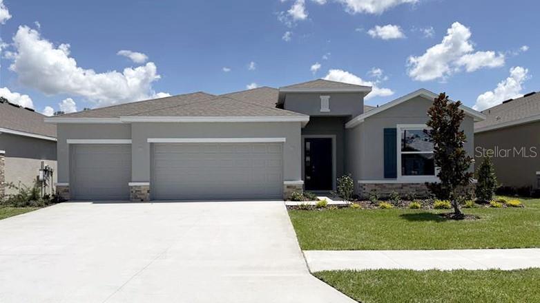 One or more photo(s) has been virtually staged. Under Construction. This one-story, all concrete block constructed home has a truly open concept plan, featuring a large great room and a well-appointed kitchen with a dining area that flow out to a covered lanai. The Bedroom 1 which includes Bathroom 1 is located at the back of the home for privacy. Three additional spacious bedrooms, one with its own Bathroom 1 and walk-in closet, share the front part of the home, as well as a spacious laundry room with extra storage closet. This home comes with installed stainless-steel dishwasher, range, and microwave. Pictures, photographs, colors, features, and sizes are for illustration purposes only and will vary from the homes as built. Home and community information including pricing, included features, terms, availability, and amenities are subject to change and prior sale at any time without notice or obligation. CRC057592.