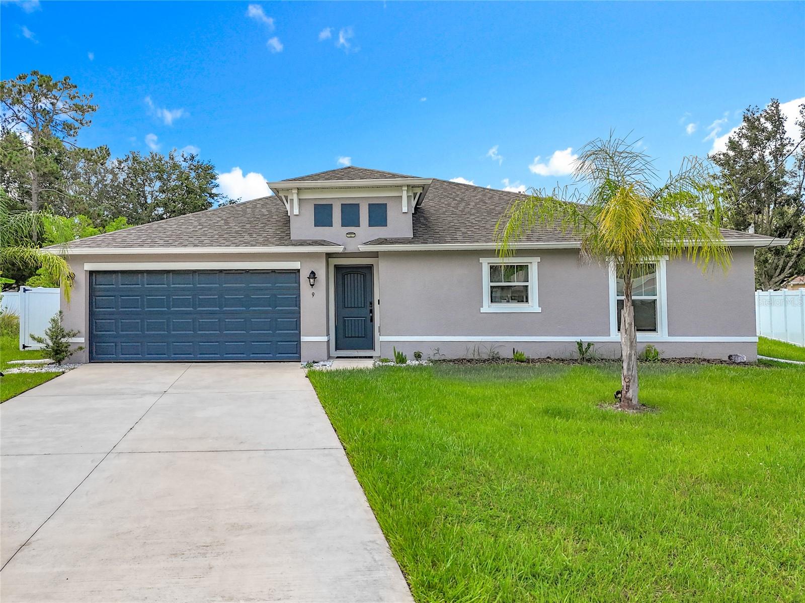 Fully furnished and move-in ready, this 2022-built home at 9 Rolls Royce Ct S in Palm Coast offers 4 bedrooms, 2 bathrooms, a 2-car garage, and 1,650 square feet of beautifully designed living space. The open-concept layout features a stylish kitchen with stainless steel appliances and quartz countertops, a spacious great room with high ceilings, and a serene primary suite with a walk-in closet and en suite bath. Three additional bedrooms provide flexibility for guests or a home office, and all furnishings, décor, and essentials are included. Enjoy the expansive backyard—perfect for entertaining or adding a pool. With modern finishes, open floor plan, and a prime location near shopping, dining, and the beach, this turnkey home is perfect as a primary residence, vacation retreat, or rental investment.