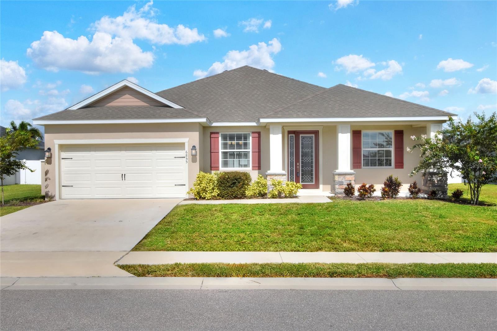 Located in South Lakeland’s gated community of Treymont, this Savannah model was built in 2022 by Highland Homes and offers over 2,100 square feet of living space. 4 bedrooms, 3 baths plus an office. Amazing curb appeal with beautiful landscaping. The interior layout of this desirable 1-story home features an open floor plan. The spacious family room is made light and airy by the high ceilings and abundance of natural light flowing from the glass doors. The beautiful and open kitchen includes a high top bar and pantry. The primary bedroom includes a walk-in shower, dual vanity, water closet and walk-in closet! The screened lanai overlooks a lovely, private lawn with white vinyl fence. This beautiful home can be yours for $540,000.