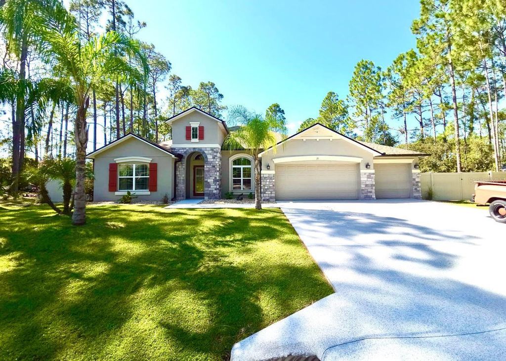 Photo of 15 Lake Placid Lane, Palm Coast, FL 32137 (MLS # FC313370)