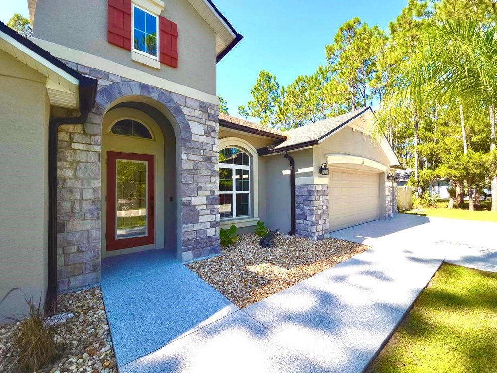 Photo of 15 Lake Placid Lane, Palm Coast, FL 32137 (MLS # FC313370)