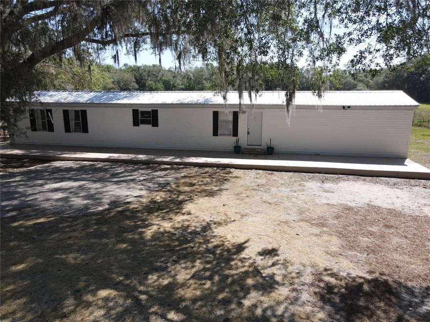 Welcome home to this inviting 3-bedroom, 2-bath property situated on 1.25 beautiful acres in a peaceful country setting. Inside, you’ll find luxury vinyl plank flooring, a beautiful concrete countertop and newer appliances in the kitchen, textured walls, a versatile flex room, and plenty of storage, along with valuable updates including a 2020 roof, a 2023 hot water heater and 2020 HVAC for added peace of mind.

Step outside and enjoy the beauty of nature from the massive concrete front porch or relax on the lovely back deck overlooking the property. The property also features fencing along the front with a lockable gate, adding privacy and controlled access. Additional features include spray insulation beneath the home’s skirting for added efficiency and a newer gravel driveway. With low taxes and a location convenient to both Bronson and Williston, this home offers space, comfort, and the relaxed lifestyle buyers are looking for.