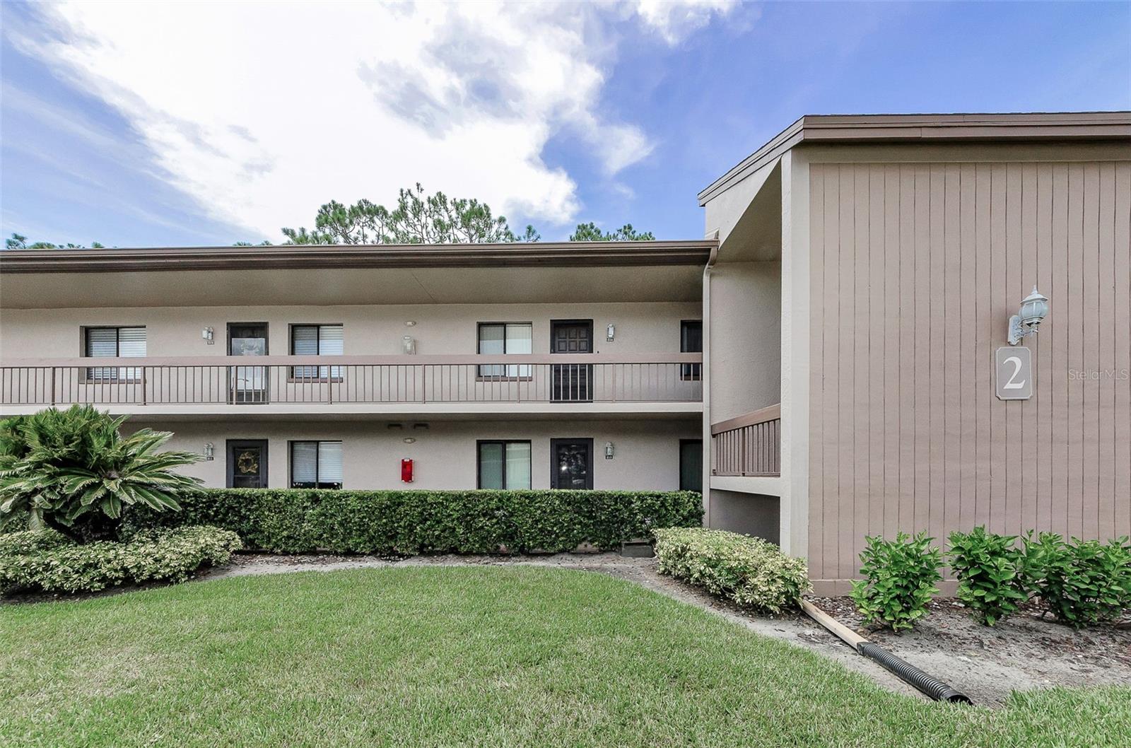 Come and see this amazing 2/2 FIRST FLOOR condo located within the East Lake Woodlands Community! Super clean and ready to move in! You will love the wood look plank flooring and the open concept living area that leads to your private, enclosed patio that overlooks lush green fields behind it and occasional wildlife that pass thru. NO REAR NEIGHBORS! This home offers a split bedroom plan with the spacious master that has 3 separate walk-in closets (definitely no shortage of storage in this unit)! The master bath offers a walk in Shower, large vanity with makeup table area, linen closet, and lots of natural light! The second bedroom is nicely sized with a large walk-in closet and the hall bath is just outside this room. In the Hallway is a double sized Closet for storage too. There is a full-size washer and dryer in the closet on the patio. You will have a covered parking space just outside your front door and there is plenty of guest parking too. All your utilities starting with the exterior maintenance, basic cable, insurance on the building, water, sewer, and trash, community pool are included in your monthly Condo Fee. This is a pet friendly community allowing for 2 pets weighing no more than 20 lbs each. The home has been freshly painted. This community sits within a larger community that has biking and walking trails thru out it, and you can join the Ardea County club that offers two 18 -hole golf courses, a remodeled country club, restaurant, and so much more! It's central location allows quick access to grocery stores, drug stores, entertainment, restaurants, airports, hospital and shopping malls. Don't miss this incredible opportunity to own this well maintained first floor condo! Schedule your showing today!