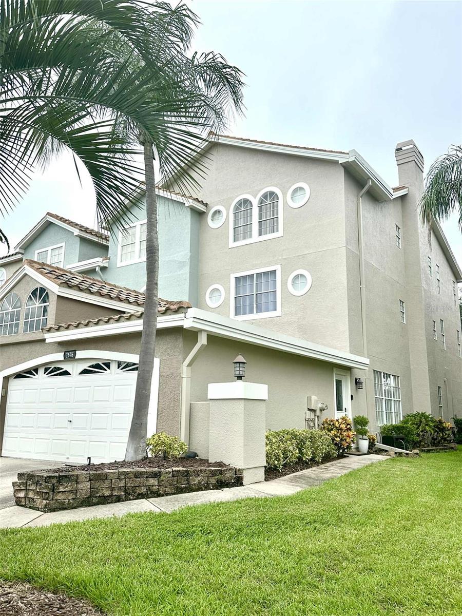 Beautifully maintained end unit townhome offers 4 bedrooms, 4.5 bathrooms and a 2-car garage in gated community! This home has something for everyone with its abundant space, tons of storage and flexible floor plan. Enter into the bright and open living room with corner wood burning fireplace. To your left is your garage door entry. The living room is spacious with high ceilings, crown molding and plenty of windows, this end unit gives us extra windows which brings the sunshine in. The staircase to the upper floors is between your living and dining room. The dining room is spacious and boasts a chair rail and a lovely wall of windows that make the space light and bright; enjoy a bar that is open to the kitchen great when entertaining; The kitchen is large with a beautiful breakfast nook. The kitchen has nice wood cabinets, stainless steel appliances, an island for extra storage and an amazing pantry with abundant shelving. Through the French doors off the kitchen is the serene screened in lanai that overlooks the lush conservation land behind. Enjoy your morning coffee or spend your days and evenings taking in the serenity of your surroundings in this covered bonus space. Your laundry room come with it extra storage and tub sink. Head up the stairs to your second floor where there are two very large bedrooms, each with walk in closets and en suite bathrooms. There is a closet in the hallway that provides extra storage space. Head up to the top floor to the third and fourth bedrooms, which also boast walk-in closets and en suite bathrooms. Have your master on the second or third floor; your options are endless! The front bedrooms overlook your beautiful neighborhood; the rear bedrooms overlook the lovely conservation land. All rooms are light and bright and feel very open. Enjoy all of this in addition to the community pool and tennis courts! Do not miss out on the opportunity to rent in this sought after neighborhood!