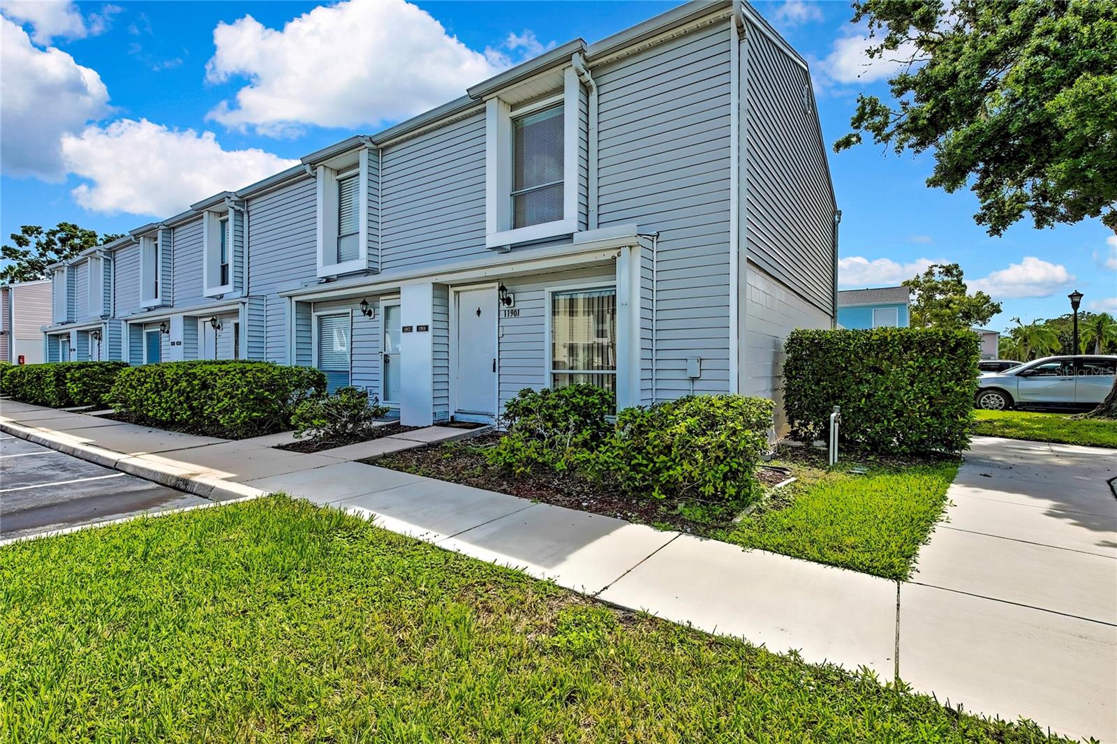 Come and see this highly sought-after private pool community of Westwind Place perfectly nestled between Citrus park and Westchase. What a rare find, 2 bedroom 1.5 bathrooms, two story end unit townhouse. The ground floor features an ample living-dining room area along with a spacious kitchen and half bath. Sliding doors located in the kitchen area will give you access to your screened in lanai w/access to back yard. You'll find ceramic tile throughout the entire first floor including a laundry room closed under the stairs and a newer vinyl plank flooring on the second floor. Two bedrooms and one full bath occupied the second floor of this property. Additional features include an in-unit washer and dryer for added convenience, and low monthly HOA fees. Best of all, no flood insurance is required, adding peace of mind and value to your investment. Residents of this well-maintained community enjoy access to a sparkling community pool, the perfect place to cool off, relax, and meet neighbors. Literally just steps from your door are not only the pool but a quaint peaceful park area to walk the fur babies, barbeque or sit and enjoy the setting on one of the conveniently provided benches. Located just minutes from everything in the heart of Tampa, this home is a commuter’s dream with easy access to the Veterans Expressway and only 15 minutes to Tampa International Airport. Shopping enthusiasts will love the proximity to Citrus Park Mall and the boutiques of Westchase. You can also indulge in the area’s renowned specialty dining, while outdoor lovers will enjoy nearby access to the Upper Tampa Bay Trail and other recreational amenities. And when it’s time for a beach getaway, Florida’s top-rated Gulf beaches are just a 30-minute drive away. This home truly offers a functional floor plan, prime location, and unmatched value. Whether you’re looking for a year-round residence, a seasonal retreat, or a low-maintenance lifestyle, this property is perfect for you. The seller has strategically priced to home so that any improvements wanted or needed will only add equity and value. Update right away or do it as you live in it. One of the best ways to make your way to this highly desired community without the high end budget to get there. Come make this home yours.