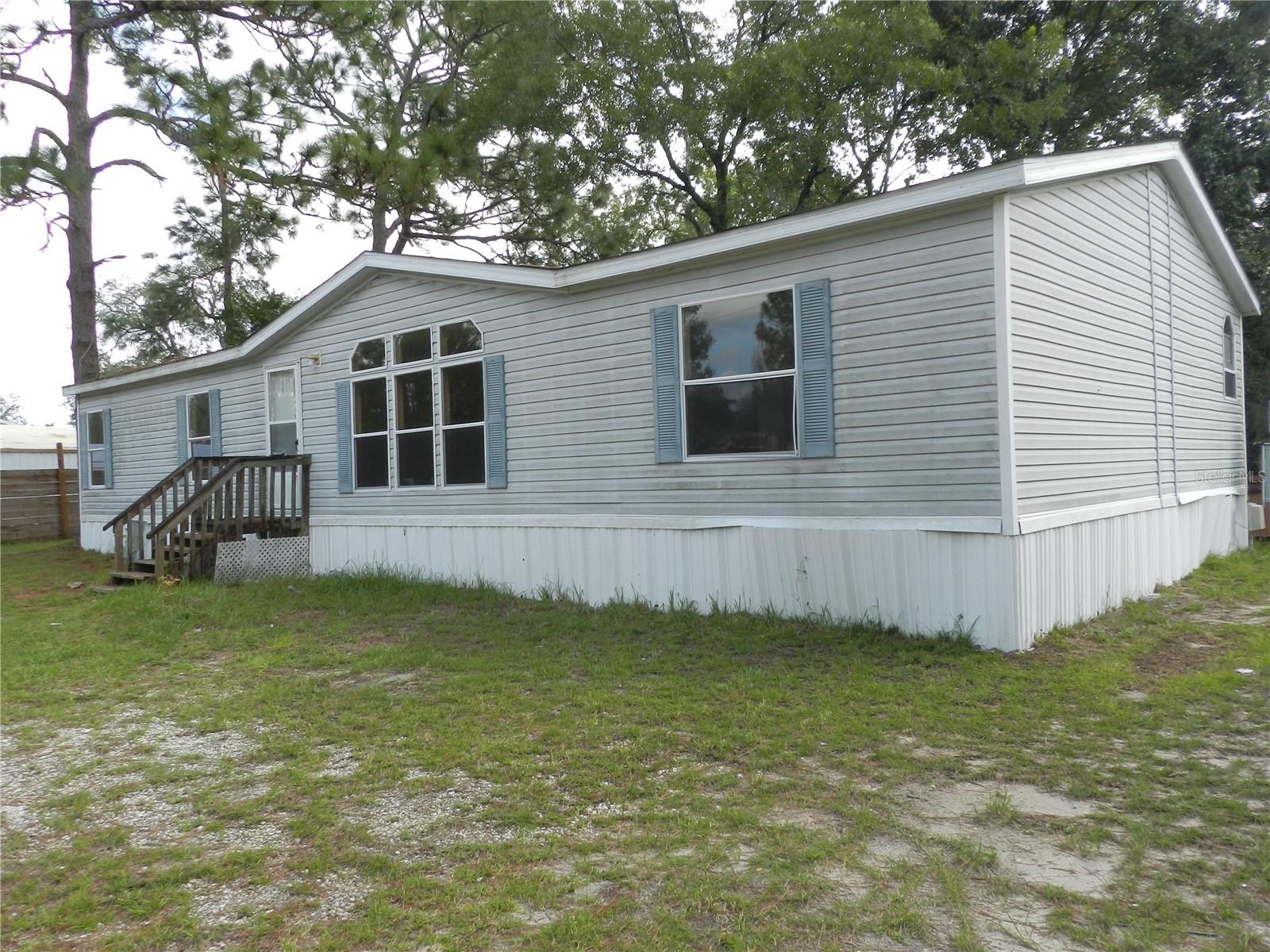 3 bedroom, 2 bath manufactured/mobile home on a large corner lot. Vaulted ceilings, all bedrooms have walk in closets. Inside laundry room. Home is in need of repairs. Vynal sided exterior. Room for RV's, boats, etc. Downtown Crystal River is approximately 10 minutes. Close to shopping, Wallmart Super Center & restaurants. Approximately 1 1/2 hours drive to Tampa. Convenient to US 19 and the Suncoast Parkway. Near Crystal River and Homosassa. All room dimensions are estimated. Buyer should measure all rooms for exact sizes and verify all information herein. DO NOT USE THE REAR STEPS. THE REAR STEPS ARE ARE UNSAFE.