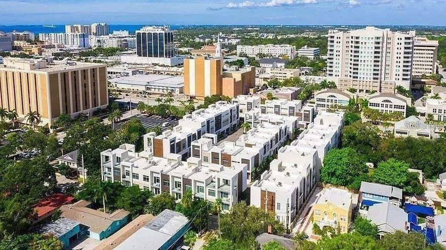 DOWNTOWN SARASOTA Annual rental FURNISHED.  2BR + loft downtown townhouse. Owner provides streaming service. Reimburse Owner for WI-FI; Tenant responsible for electric and water. The Q defines LUXURY & QUALITY with a DOWNTOWN LIFESTYLE in an intimate 40 home community. Superbly planned & designed in a premier location, the Q is one block to Main Street - walk to shopping, restaurants, theater & all the arts. THIS IS THE MOST SOUGHT AFTER FLOOR PLAN IN THE Q. DAILY LIVING IS ON THE FIRST FLOOR AND THE BEDROOMS & LOFT ARE ON THE 2ND FLOOR. The FIRST FLOOR offers the Chef's Open Kitchen with island, breakfast bar, BOSCH stainless steel appliances, NATURAL GAS COOK-TOP, LUBE ITALIAN CABINETRY, QUARTZ COUNTER-TOPS, HANSGROHE faucets, custom lighting, VOLUME CEILINGS, OPEN PLAN LIVING & DINING ROOM. ROSEWOOD 8ft SOLID CORE DOORS throughout, Porcelain tile floors, Miami-Dade IMPACT RATED HURRICANE WINDOWS & DOORS, tankless gas hot water heater * FULL BLOCK CONSTRUCTION * The Master Retreat has a private balcony, large walk-in closet, glamorous bath with 2 vanities, soaking tub & large separate shower. Guest Bedroom with Murphy Bed, private bath & walk-in closet. There is also a Loft area for a DEN if needed. Walk to movie theaters, Whole Foods, Marina Jack's. Short drive to St Armand's Circle and Lido Beach. One look & you'll fall in love! Unit comes with attached garage - 1 space. Also available for a 3 month minimum rental at $5000/mo from December through April.