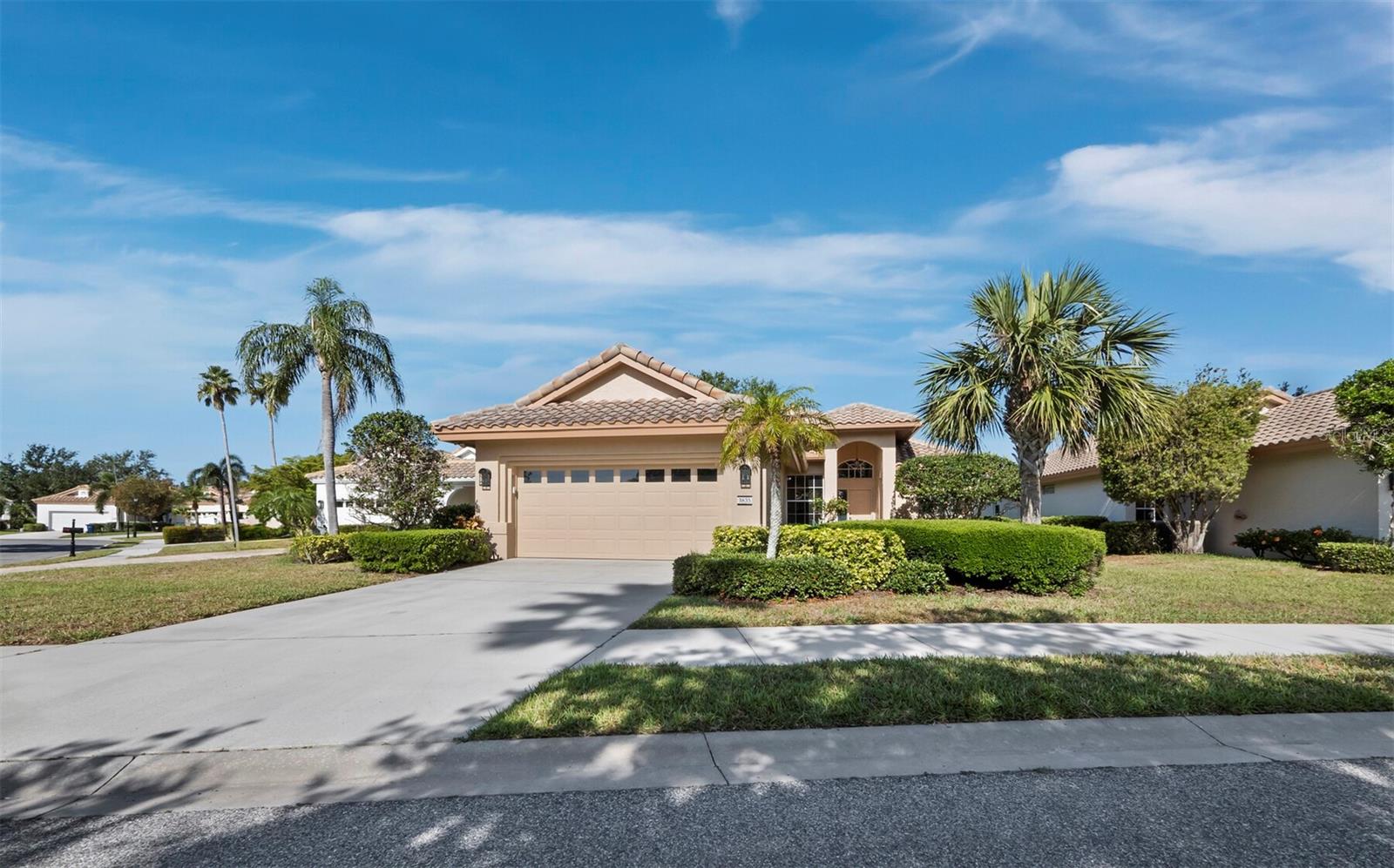One or more photo(s) has been virtually staged. Premium lakefront location with big sunset views. Maximizing the view, the family room, living room and primary bedroom all boast large windows and slider access to the huge screened lanai. The semi-open floor plan and high ceilings make this home light and bright. This home has been lovingly maintained with neutral finishes throughout. The well-designed kitchen with expansive granite countertops is open to the large family room (17-by-15-foot) and has great views of the lake. The grand living room, measuring 13-by-20 feet with three panel sliders to access the lanai, creates the ultimate indoor/outdoor Sarasota Lifestyle. The living is easy in Mira Lago at Palmer Ranch, one of our most popular maintenance-free, gated communities. Low HOA fees also include exterior maintenance and cable TV! ! Enjoy everything Sarasota has to offer with quick access to world-famous beaches, great dining, shopping and our vibrant downtown for arts and entertainment.