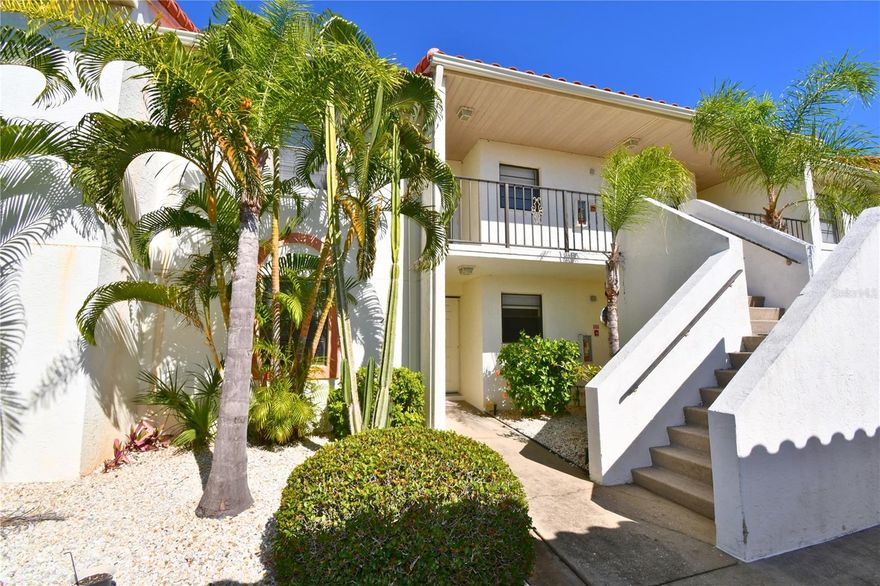 It's quiet, peaceful, and the WATERVIEW from your enclosed patio is stunning!! Well maintained 2 bedroom, 2 bath, condo on the first floor, with no stairs to walk up.  If you're looking to downsize and would like to be minutes away from the beach, this is it. Savvy investors, snowbirds, or simply looking for a first floor condo in the sought-after Oakwood community. Play a game of tennis or dip into the community pool, as this condo complex have both. Park your car in your assigned space and walk into your brightly lit, water-view condo with its open split-bedroom layout, featuring tile flooring in the kitchen and laminate throughout the main living spaces. An equipped kitchen is good to have and this one doesn't disappoint, including a microwave, refrigerator, range, dishwasher, a mail desk with extra storage and a pass-through window with a breathtaking water view of the pond and it opens to the dining area. The master suite impresses with a large walk-in closet towards the back, an ensuite bathroom with a separate vanity area and sliding glass door that'll lead you to the screened lanai. Enjoy many evenings with serene, tranquil views of the water. Additional features of this condo include a stackable washer and dryer in an interior laundry closet, large covered lanai accessible through living room sliders, an assigned covered carport, and a large, private exterior storage closet.  Updates include, a 2020 water heater and a new AC unit installed in 2024 for year-round comfort. Oakwood community residents enjoy access to a swimming pool with outdoor bathrooms and tennis court and benefiting from a low-maintenance lifestyle. The community is pet-friendly, allowing up to two domestic pets (maximum weight of 25 lbs. each), and rentals are permitted, making this an excellent opportunity for full-time living, seasonal retreats, or income potential. Positioned near top-rated golf courses, charming local restaurants, grocery stores, and boating waters, this is your gateway to the best of Southwest Florida coastal living.