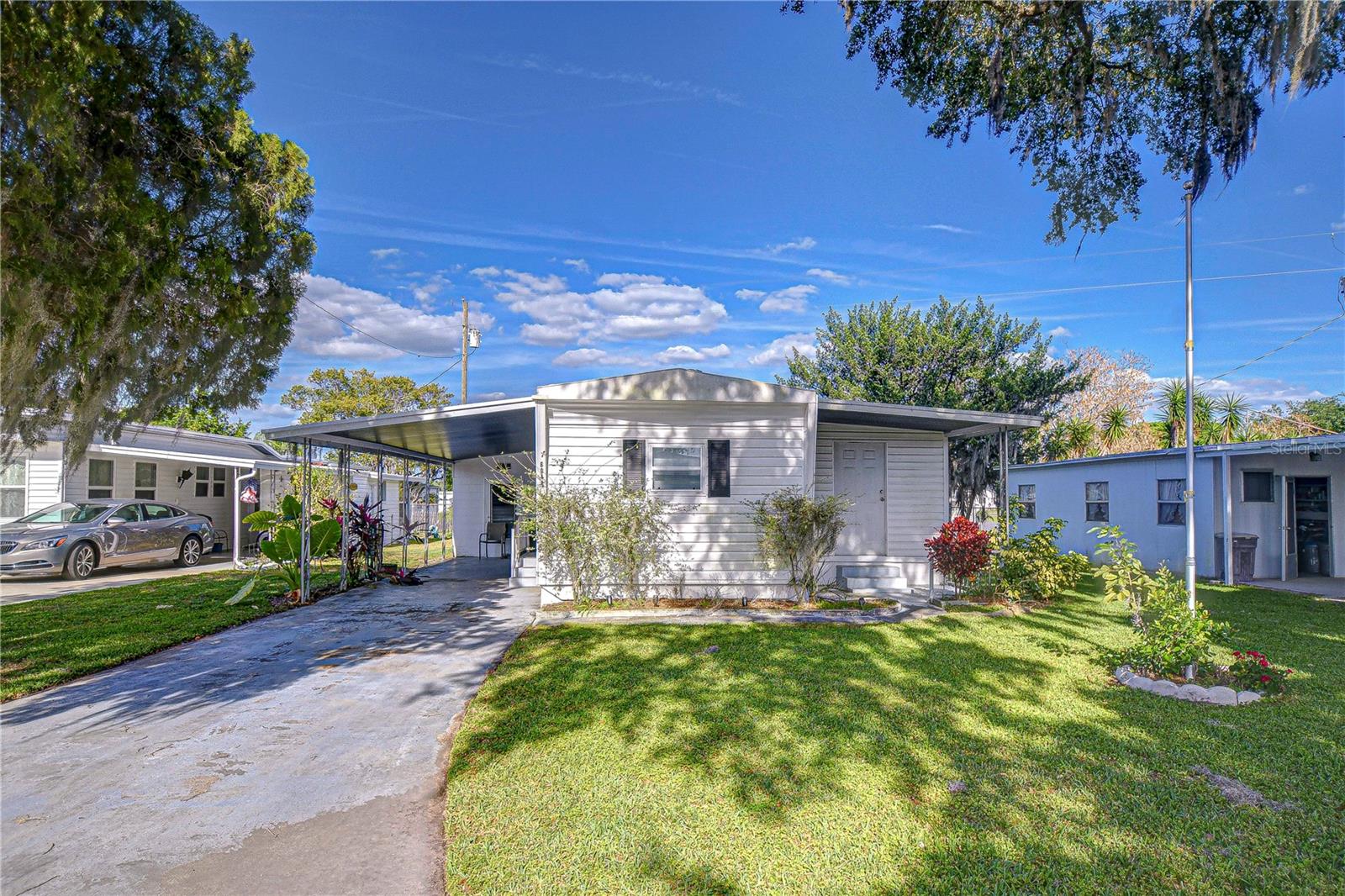 Charming 1-Bed/1-Bath Home in Green Hills Estates – Own Your Land! Discover Zephyrhills' best-kept secret
in Green Hills Estates, a welcoming 55+ community just west of Gall Blvd. This one-bedroom, one-bath
singlewide mobile home offers comfortable living in a well-maintained neighborhood with low HOA fees that
include water! Step inside to find a spacious bedroom that fits a king-size bed, a cozy eat-in kitchen, and a
versatile bonus room off the living area—perfect for a guest room, office, craft space, or TV lounge. Enjoy
Florida’s beautiful weather from the screened lanai conveniently located just down the hall from the back door.
A one-car carport adds extra convenience. This low-maintenance community offers a clubhouse with coffee
hour and social activities, ideal for those who love community involvement. Plus, you're just one mile from the
YMCA and minutes from Zephyrhills' popular eateries, shopping, and entertainment. Don’t miss this
opportunity to own your own land in this delightful seasonal park! Schedule your showing today!