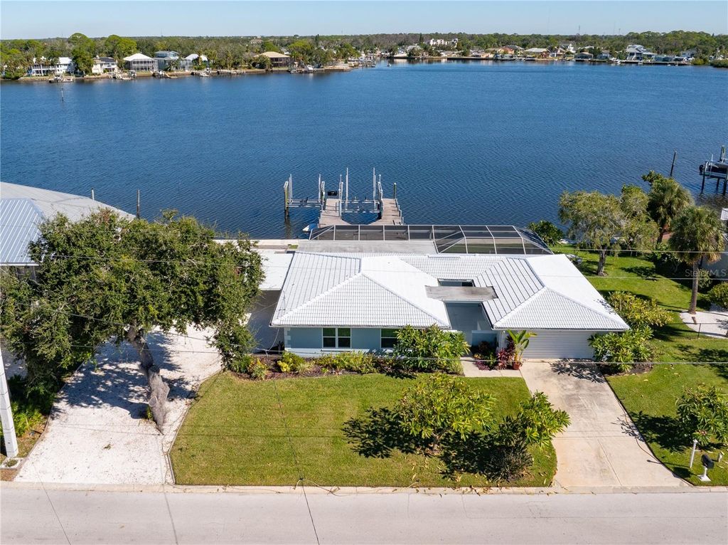 Photo of 5027 Waterside Drive, Port Richey, FL 34668 (MLS # TB8447506)