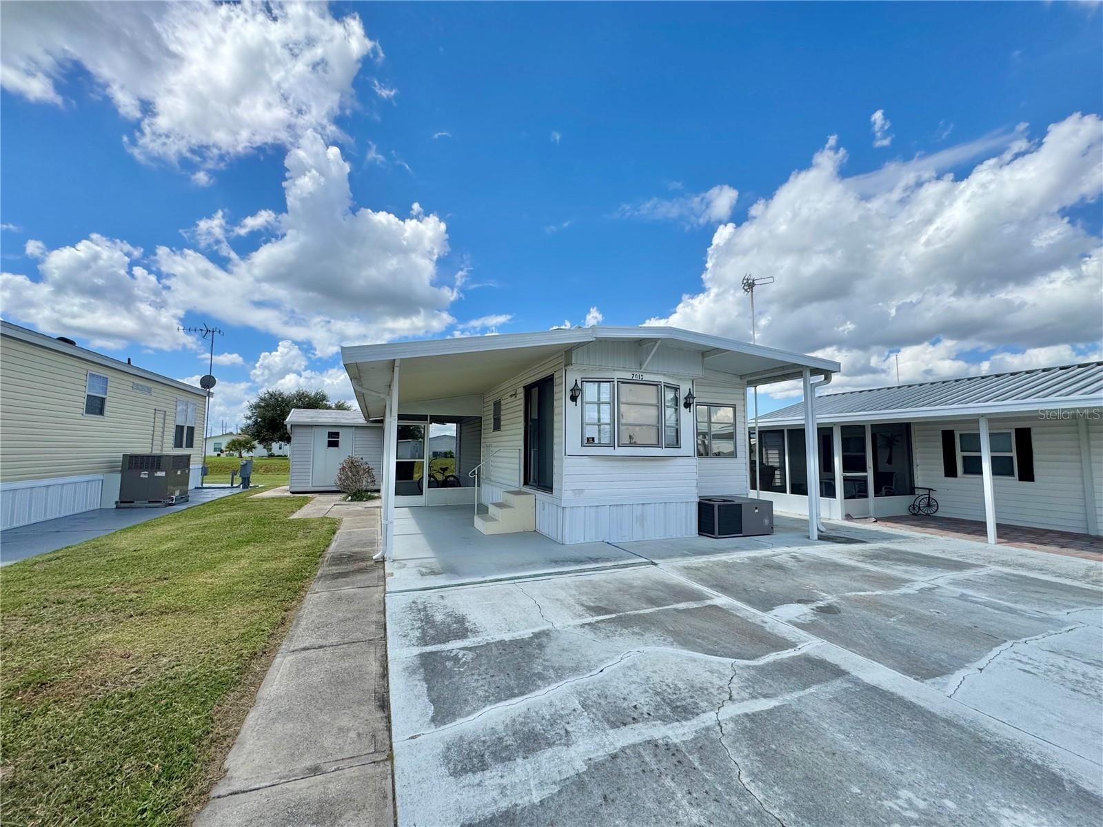 Discover this inviting home in an active 55+ gated waterfront community, perfectly situated along the canal that connects Lake Hamilton and Lake Henry, offering boating, fishing opportunities, and a peaceful Florida lifestyle. Step inside to the living room that flows into the cozy dinette and functional kitchen. The bedroom features built-in drawers, a desk area, a 4x4 walk-in closet, and an extra coat closet for storage. Relax on the 8x10 screened patio, perfect for enjoying Florida breezes, or take advantage of the 6x10 powered metal shed for hobbies and additional storage. This community is brimming with activity with a clubhouse that hosts community get-togethers, card games, bingo, and so much more— that makes it easy to stay social and connected! Low HOA fee of $90 monthly, covering water and sewer. The community operates on a 99-year land lease. *This is a no pet permitted community*