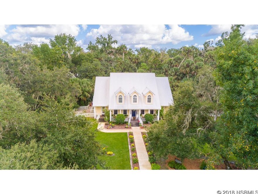 Enter your gated fenced 13 acre estate on Lake Ashby a 1600 acre deep water boating lake just 20 minutes to Sanford/Orlando airport, & 20 minutes to the Beach.  Custom built 3 bedroom 3 bath with possible 4th with Den/office  3934 sq ft home has paid attention to every detail and upgrade imaginable. Sophisticated country home with front and back  porches, huge stone wood burning fireplace, high efficiency Norandex windows and doors, 40 year durable galvanized metal roof and 40 year plus Hardie plank board siding,  whole home generator, security system along with a in home audio system and the list goes on.  Master bedroom is located downstairs with 2 additional  bedrooms and a large loft landing upstairs which is open to the downstairs living space. The home has a chefs dream kitchen, granite counter tops,stainless appliances which include double ovens, a warming drawer, 48' gas range with 4 burner cooktop, grill and griddle and a huge 36' side by side refrigerator. After a day mending to the horses Kick off your boots when entering the home through the mud room located right off kitchen.  The property is fenced with 6 paddocks that are high and dry for the horses, and a A/C dog kennel with room for up to 7 kennels.  Your backyard has a large 20x20 deck leading to a beautiful well maintained 520ft boardwalk that takes you to the 16x24 dock on the lake where the views are endless. There is a 40x60 Barn and hay loft with running water and electric, restroom and large paver patio which at this time has been transformed into the successful wedding venue  business  "A Vintage Affair at Lake Ashby" Wedding venue business and its inventory included, this property is one of the few in the county who  has a county special exception zoning variance to hold special events on rural property approved and changed in 2012. Don't miss out on this opportunity to own this gorgeous peace of heaven while using your talents to have your own business with potential galore.