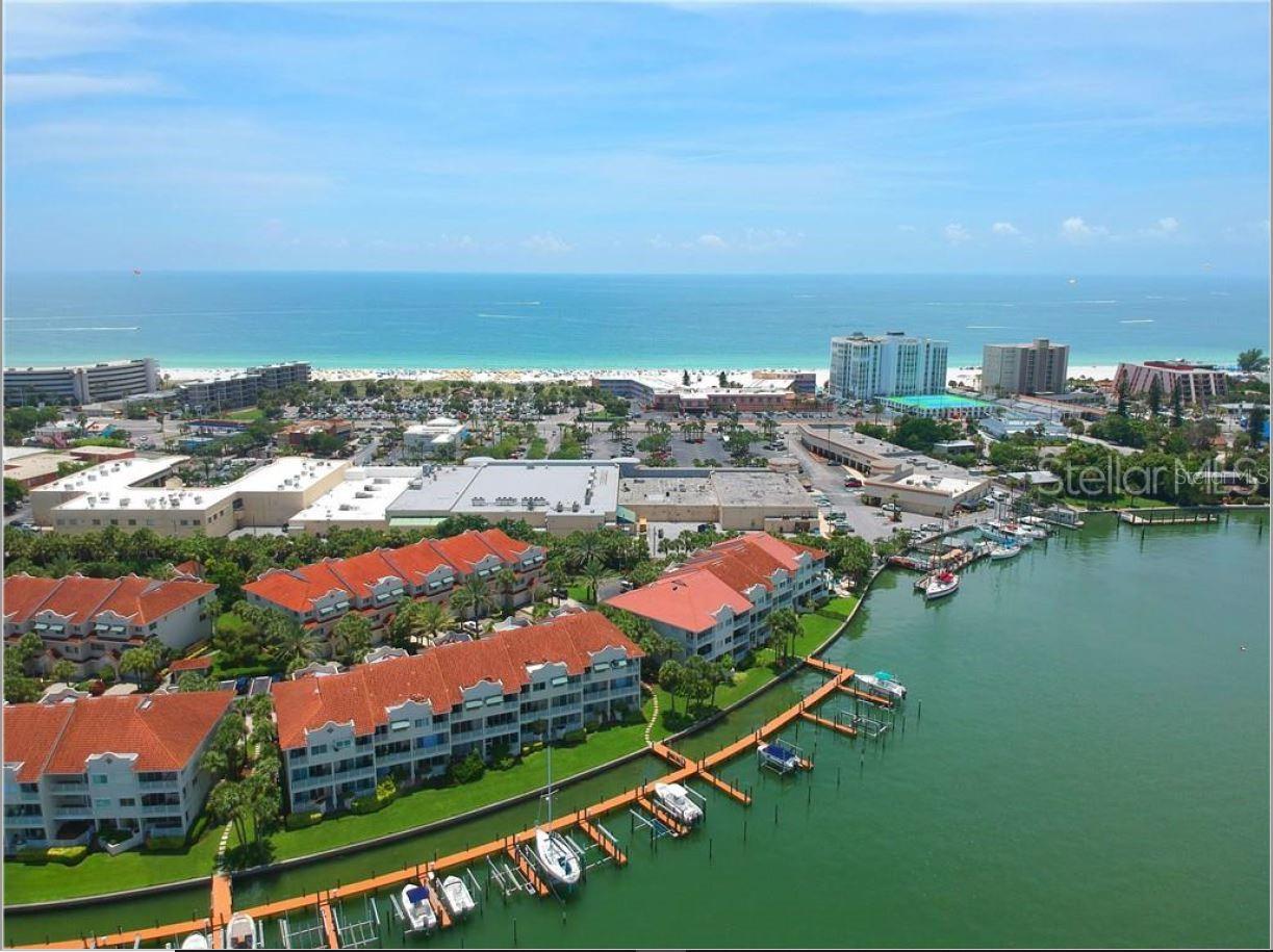 The Mirabella Townhome Community has a private marina feel with heated pool and cabana bath. This updated, waterfront townhome is within two blocks of the Gulf of Mexico with easy access to shopping, parks and restaurants. With three bedrooms and four full baths, this residence also has a first floor bonus room for games or guests! Amazing open water views across Boca Ciega Bay presented from the Great Room, Master Suite and Guest Suite. The open floorplan has granite counters and stainless appliances in the modern kitchen, and a great room with sliding doors to the covered waterfront porch. The Master Suite on the third floor has a private waterfront balcony, large, tiled shower, dual vanities, and a walk-in closet. Bonus space on the first level presents opportunity for guests, teens or in-laws with full bath and covered waterfront lanai. Private attached garage and storage. Rent includes water, sewer and trash, pool and lawn maintenance. A deeded boat slip with lift may also be available to the tenant at an additional fee. This pet friendly community allows for two large dogs, at landlord discretion. Just a 15 minute drive to Downtown St. Petersburg, 30 minutes to Tampa or Bradenton.