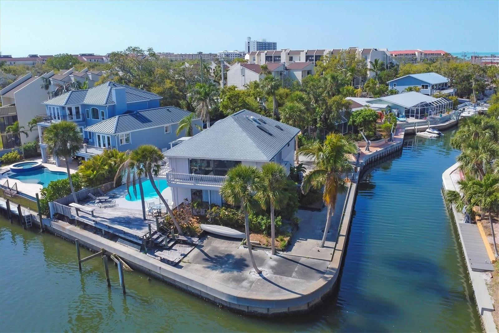 Welcome to 1241 Big Oak Lane, a stunning waterfront property on one of Siesta Key’s most private and desirable streets. Boasting nearly 200 feet of frontage directly on the bay-front of Sarasota and a Deep water Canal, this home is a boater’s dream, offering breathtaking water views and endless possibilities. Located in a rare RMF-zoned area, the property allows for completely legal short-term rentals of less than seven days, making it a high-income-producing opportunity. While the home offers incredible potential and did NOT flood, it does require renovations, making it an excellent investment for those looking to customize their dream waterfront retreat. The property already features a great existing pool and a mother-in-law-style kitchenette, making it well-suited for rental income with some updates. Alternatively, with its generous lot size and zoning flexibility, this site is prime for redevelopment, offering the opportunity to build a luxury waterfront estate that maximizes its direct Intracoastal setting. A trolley and bus stop just steps away provide easy access to Siesta Key Village and the beach, eliminating parking and traffic concerns. Whether you're looking to renovate, rent, or redevelop, this is a rare opportunity in an unbeatable location. Schedule your private showing today—no trespassing allowed!