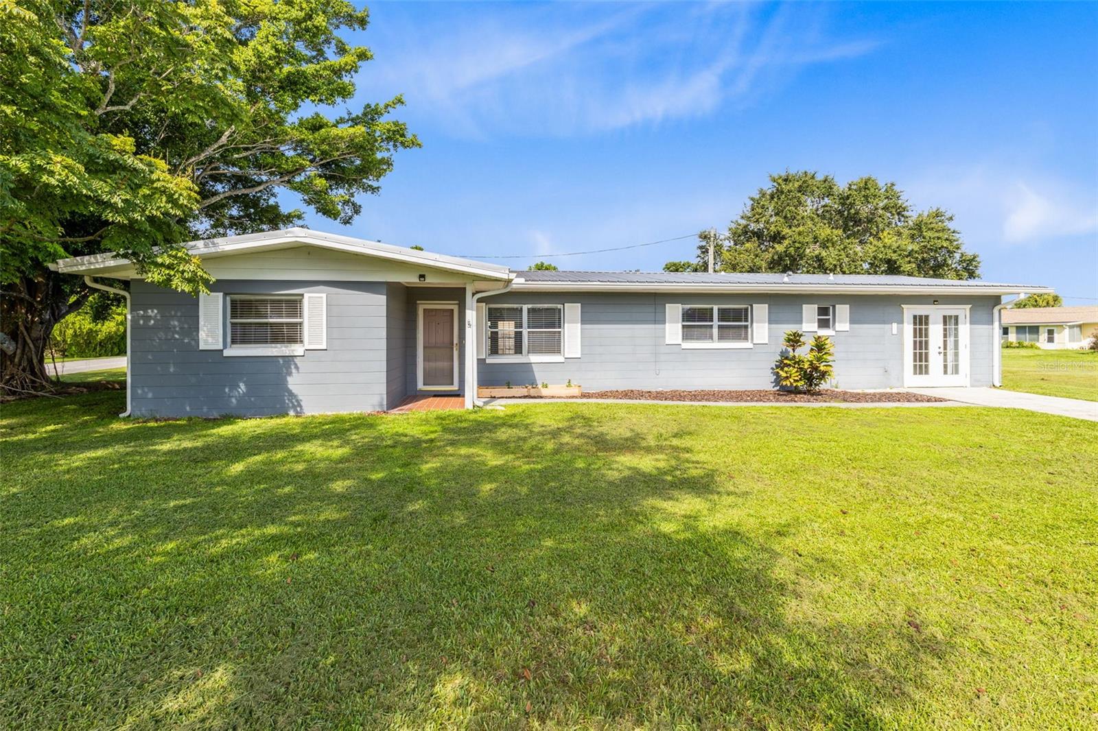 This charming 3 bedroom, 2 bath home with large bonus room, PLUS Florida room, is just 1 block from the St. Cloud lakefront! The centrally located laundry room and kitchen with updated stainless steel double oven, dishwasher, plus range and range hood makes every day chores a breeze. Each room includes a generously sized closet, and the bonus room provides extra living space and features bonus storage space and not one, but TWO built-in closets. Each bathroom has been tastefully remodeled for a sleek, modern look and feel. This corner lot home is perfectly situated to enjoy all that the Saint Cloud lakefront and Marina have to offer, including the updated kid's splash pad, playground, walking trails, pier, restaurant, beach volleyball and more!