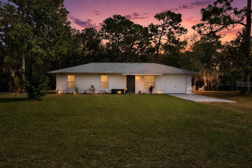 One or more photo(s) has been virtually staged. Discover this beautifully fully renovated, move-in ready home in the heart of Homosassa, Florida! Situated on a private 1.1-acre lot, this 3-bedroom, 1.5-bath concrete block home offers the perfect blend of modern upgrades, peaceful country living, and everyday convenience. With paved road access, no flood insurance required (Flood Zone X), and endless outdoor potential, this property is ideal for first-time homebuyers, families, investors, or anyone looking for a turnkey Florida home with land.

Completely remodeled from top to bottom, this home features a brand-new roof, new ductwork, central A/C, energy-efficient windows, updated appliances, luxury vinyl plank flooring, quartz countertops, fully renovated kitchen and bathrooms, and fresh interior and exterior paint. Every detail has been thoughtfully updated, making this a true turnkey property ready for its next owner.

Step inside to a bright open-concept floor plan designed for both entertaining and comfortable everyday living. The modern kitchen features stylish finishes, a breakfast bar, and brand-new appliances, while the dining area flows seamlessly to the backyard for effortless indoor-outdoor living. Washer, dryer, and refrigerator are all included.

Outside, enjoy an oversized cleared yard with room for pets, gardening, outdoor entertaining, RVs, boats, future additions, or creating your dream backyard oasis. Relax around the fire pit under the lights and enjoy the privacy and tranquility this unique property offers.

Additional features include a spacious garage with extra storage and laundry area, mature surroundings, and plenty of room to grow without the restrictions of crowded neighborhoods.

Conveniently located near shopping, dining, the Homosassa River, Crystal River, Weeki Wachee, parks, springs, fishing, boating, and outdoor recreation, this home combines modern comfort with the charm of Florida nature and country living.

If you’ve been searching for a renovated home with acreage in Homosassa, this is the one. Schedule your private showing today and discover all that this hidden gem features!