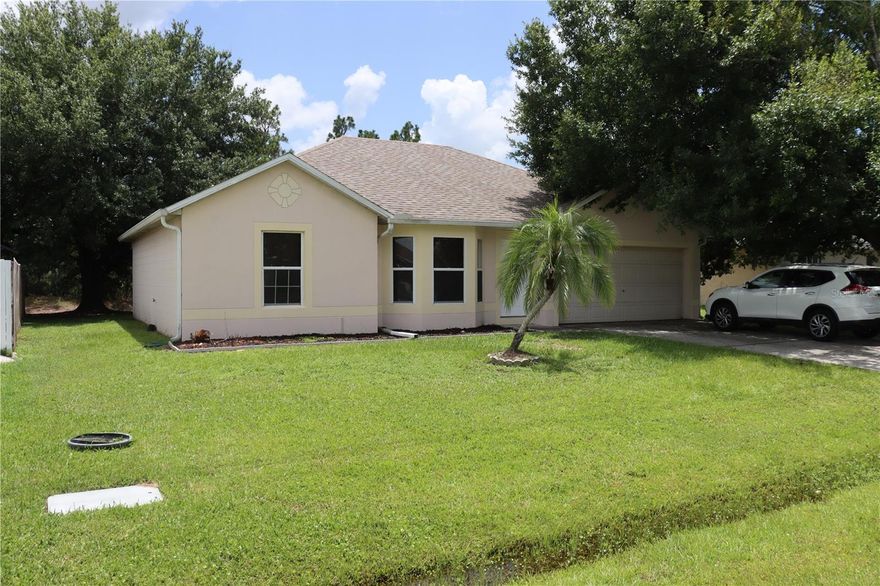 Come see this well maintained 3 bedroom, 2 bath split plan home. A lot of upgrades on this one in the past few years. New Stainless steel Refrigerator and Microwave 2024. Guest bathroom tub and toilet installed 2024. AC Unit 2023. Water Heater. 2022. New Kitchen Floor 2018 The master bedroom features a spacious walk-in closet and the master bath has been completely remodeled and includes a walk-in shower installed 2024. Roof installed in December 2017 also carpet in the master and guest bedroom. The third bedroom is tiled and includes a built-in wall unit/shelving system and is ready for anything from a guest room, to a craft room or even a home office. The home also boasts a large, eat-in kitchen. The home has been freshly painted inside with 2017 ceilings fans and light fixtures. The 2 car garage has plenty of storage as well as pull down stairs to access the attic. The garage includes a door that has been completely "overhauled" updated in 2017 and work done includes belt driven opener, all rollers, springs and exterior keypad for your convenience. The home sits on a nice sized lot and backs up to a wooded area where you have no rear neighbors! You can enjoy the peace and quiet while having your morning coffee on the fully screened back porch! This home is ready for your family so don't let this one get away!