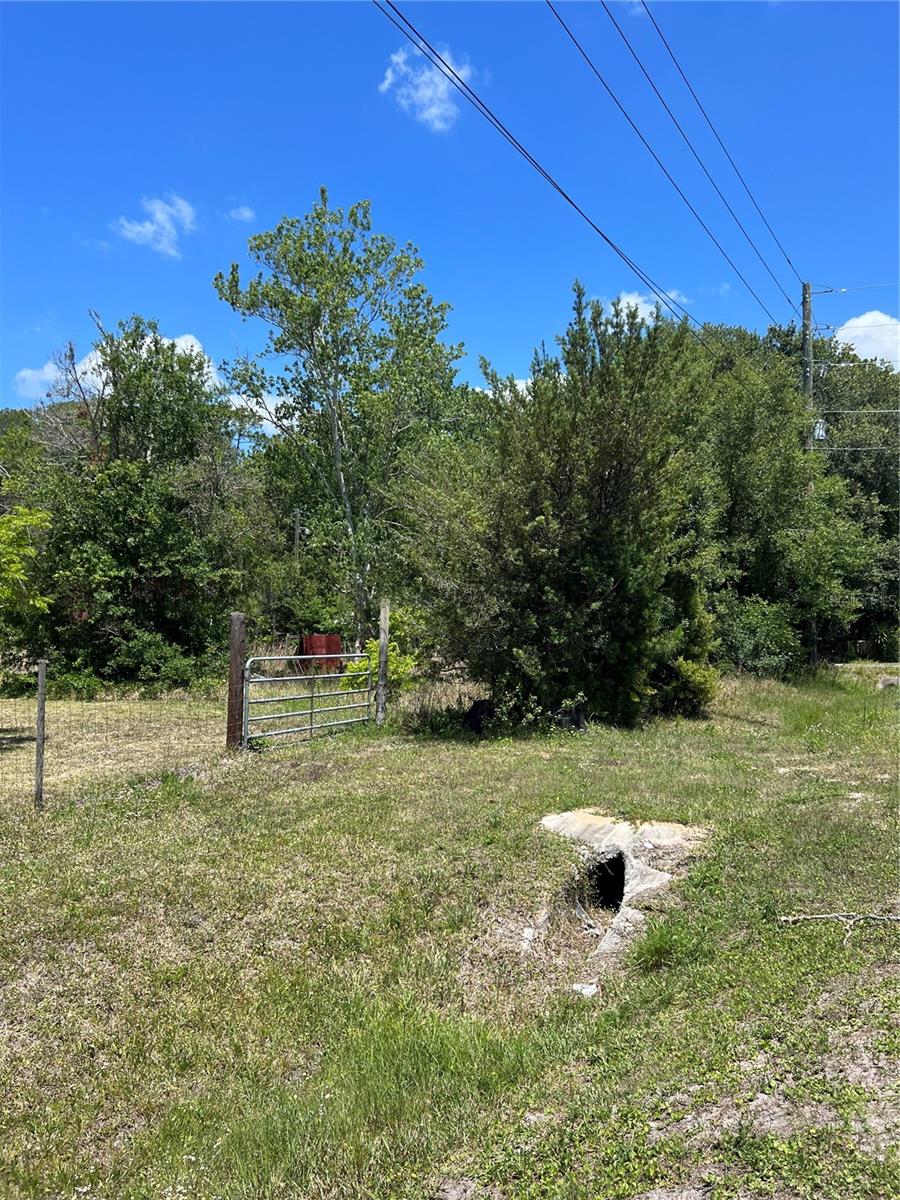 Title work already done! Lake county has issued an approval on a lot density exception Finally!!! Survey done!!This is an INCREDIBLE price on almost half acre on SR 33. Enjoy your little piece of paradise. . All lot sizes and flood info is pulled from Property Appraiser and Flood maps. When looking at old Lake county aerial photos ( see photos on listing) there appears that once there was a manufactured home on the property ( pic from 2004) - This means a possibility of a well, power and septic on the property. There is also a small pond at very back of the property in an old picture when the property was cleared. There also appears to be a full culvert, driveway and gate at front left side of property. Great property just minutes from everything.