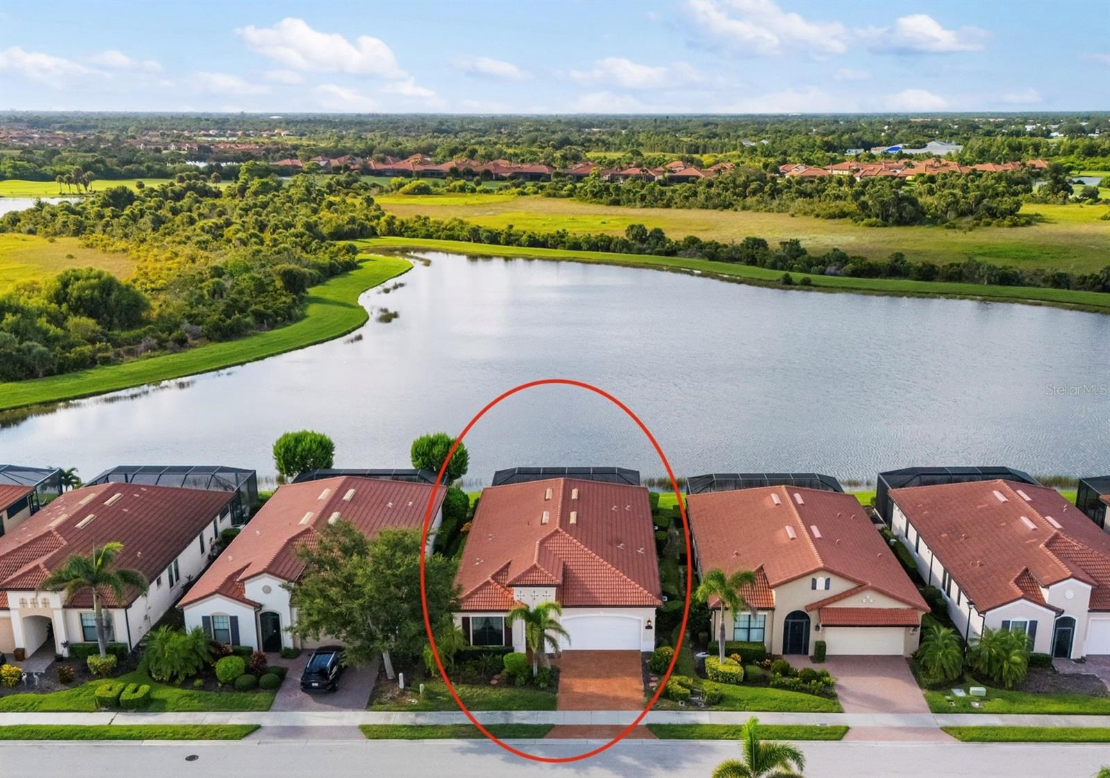 One or more photo(s) has been virtually staged. Welcome to 23823 Waverly Circle, an exquisite WCI-built Key Largo model, ideally positioned on a premier homesite showcasing panoramic water and preserve views. This elegant residence offers nearly 2,400 sq. ft. of open living space, featuring 3 spacious bedrooms each with its own private en suite plus an additional half bath, a versatile flex-room, a saltwater pool and spa, and a custom outdoor kitchen.
From the moment you step inside, you'll be greeted by soaring 10-foot ceilings, 8-foot doors, crown molding, and elegant 12x24 porcelain tile throughout. The chef's kitchen is a dream, boasting upgraded solid-wood cabinetry with soft-close doors and drawers, quartz countertops, tile backsplash, under-cabinet lighting, stainless steel appliances, a large pantry, and direct access to a versatile flex space or formal dining area.
The expansive great room is perfect for entertaining, highlighted by a dramatic tray ceiling and sweeping water views through hurricane-impact sliding glass doors. Step outside to your private backyard oasis, where a heated saltwater pool and spa, custom summer kitchen with built-in grill, vented hood, granite backsplash, and beverage fridge await. The clear-view screen ensures unobstructed lake vistas, while motorized Storm Smart Kevlar hurricane screens add peace of mind.
The owner's suite is a luxurious retreat with dual vanities, granite countertops, walk-in shower, linen storage, and an oversized walk-in closet. Two additional guest suites offer privacy and comfort, each with its own en suite bathroom. A spacious laundry room with sink and cabinetry adds everyday convenience.
This home is loaded with thoughtful upgrades, including impact-rated windows and doors, a built-in Sonos ceiling speaker system, elegant plantation shutters, upgraded lighting and ceiling fans, and a Bosch dishwasher (2023.) Improvements made in 2025 include: a new hot water heater, newly finished epoxy garage flooring, new pool filter, new ceiling fans in each guest bedroom and custom closet shelving in the kitchen. Every detail has been carefully considered in the design and finishes of this exceptional residence, perfectly situated on one of the community's most coveted homesites.
This home is located in the Golf Village and comes complete with two golf memberships included in your HOA fees, which include greens fees and exclusive access to the 19th Hole Bar and Restaurant. Sarasota National offers an abundance of amenities that elevate your lifestyle, including: *Palm Club Restaurant & Bar *Tiki Bar with pool service (there is no mandatory minimum to be spent) *Heated resort-style pool with a dedicated lap section *Bocce, playground, pickleball, and tennis courts * A 7,000-square-foot fitness center with exercise classes *Dog park for your furry friends *Luxurious spa (additional charge) In addition, the Gordon Lewis-designed golf course is located in an Audubon International Certified Signature Sanctuary surrounded by wetlands and preserves. With its close proximity to beautiful area beaches, Historic Downtown Venice, and the evolving Wellen Park, this is an opportunity you don't want to miss. Experience the lifestyle you deserve at Sarasota National - the epitome of resort style living!