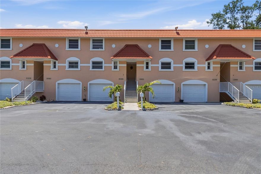 One or more photo(s) has been virtually staged. Welcome to the highly sought after Treasure Island Capri Lagoons Community.  This 2BR|2.5BA townhome has been updated in recent years with a chef's kitchen with high end stainless steel appliances including a farmhouse style stainless steel sink, granite counters, lacquer cabinets with an oversized Island with abundant storage.   The living room offers a wood burning fireplace for those cooler winter evenings. This townhome offers a one-car garage with extra storage. For all you boating enthusiasts the unit INCLUDES A BOAT DOCK WITH A 20,000LB LIFT offering easy access to the Gulf and the Intercoastal Waterway. Schedule your private showing today!
