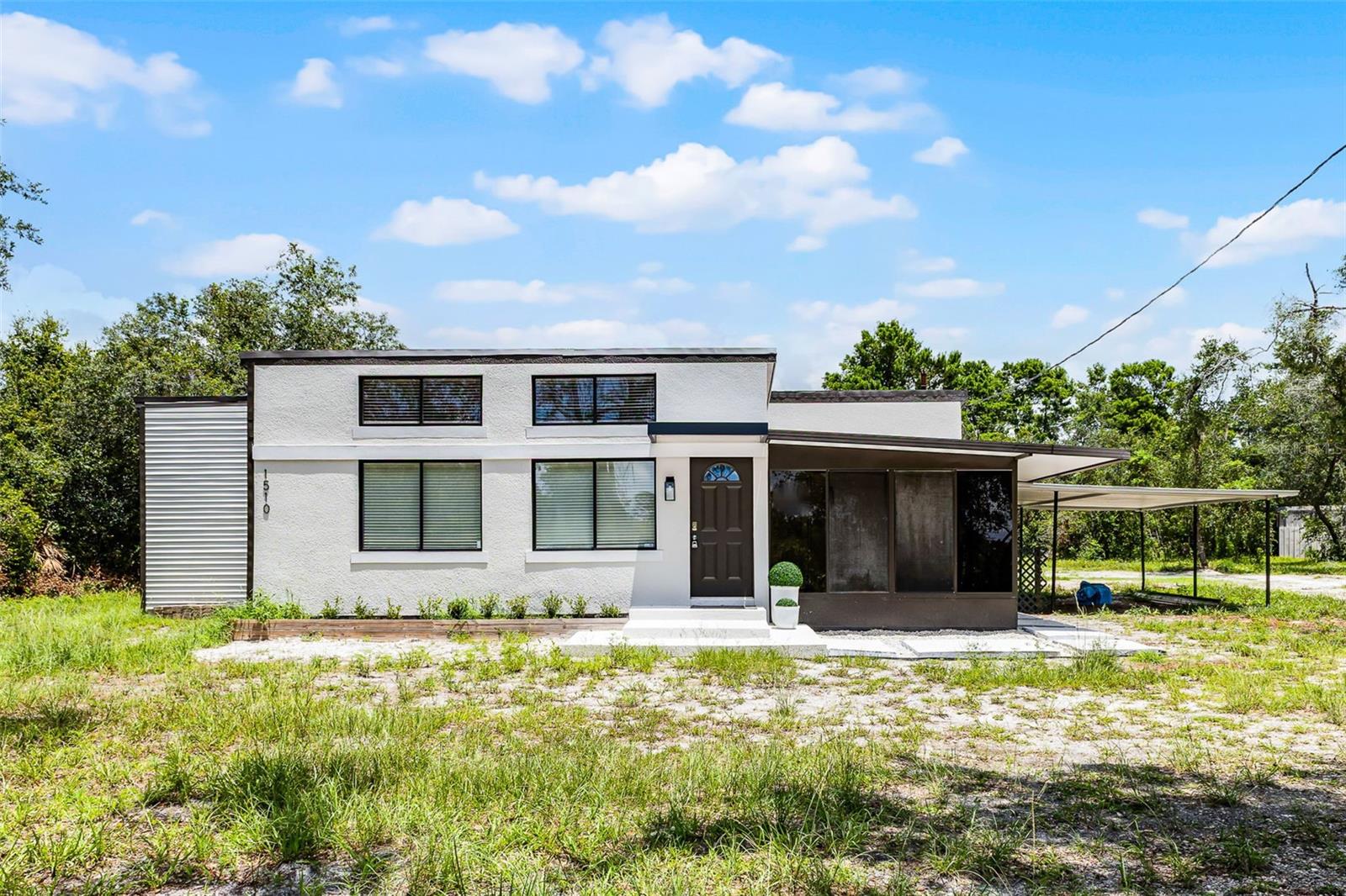 Welcome to the perfect blend of modern luxury, space, and versatility! Situated on a sprawling 1-acre lakefront lot in Deltona, this completely renovated 3-bedroom, 2-bath home with a den AND sun-room, offers the rare opportunity to enjoy peaceful residential living with the flexibility of office zoning and lakefront capabilities—ideal for homeowners, small business owners, or professionals working from home.
Don't miss this: If a qualified buyer uses seller’s preferred lender, a credit to a free appraisal to can be issued and .5 to discount points to closing costs, prepaid, or rate-buy downs.
No detail was overlooked in this top-to-bottom renovation—everything is brand new, including the roof, HVAC, plumbing, electrical, flooring, kitchen, and bathrooms. Step inside to an open and inviting layout filled with natural light, stylish finishes, and functional design. The heart of the home is the gourmet kitchen and living combo, featuring own tile floors throughout, quartz countertops, custom soft-close cabinetry, stainless steel appliances, and a large island perfect for entertaining.
The spacious primary suite includes a walk-in closet and a luxurious en-suite bath with a frameless glass shower and dual vanities. Two additional bedrooms show flexibility for guests, family, or workspace, while the second bathroom mirrors the home’s modern aesthetic.
Step outside to your own private slice of paradise—an expansive 1-acre lot with direct lakefront access as shown on the survey with the property. Whether you dream of peaceful mornings by the water, launching a kayak, or developing a scenic workspace with a view, the potential to use the access is there.
Zoned for both residential and professional office use, this property offers unmatched potential for living, working, or both. With ample parking, a serene setting, and all major systems upgraded, it’s truly move-in and business-ready.
Don't miss this rare opportunity to own a completely turnkey, lakefront home with flexible zoning in a growing Central Florida community. Schedule your private showing today!
