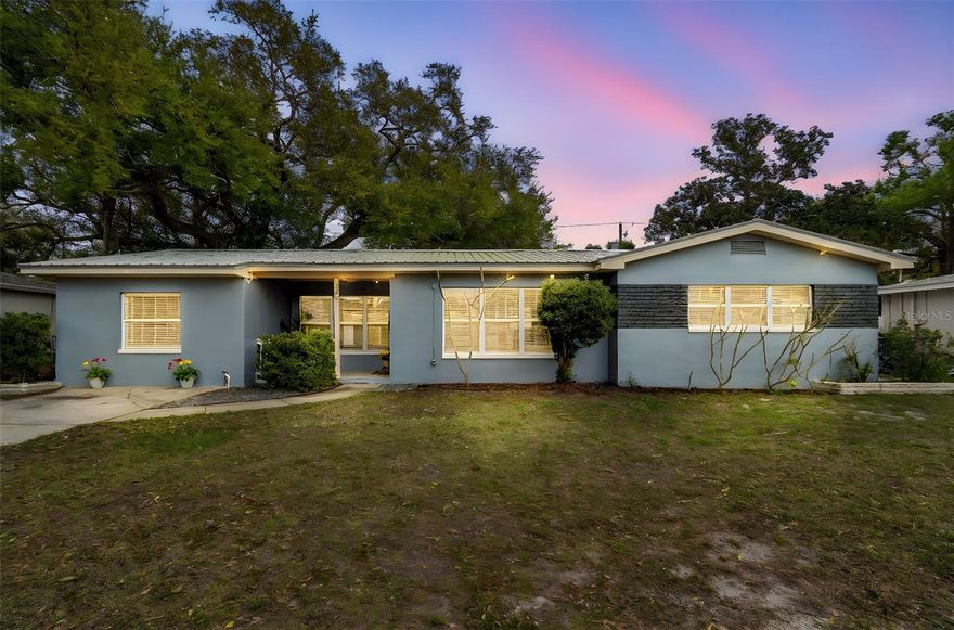 One or more photo(s) has been virtually staged. This three-bedroom, two-bathroom St. Petersburg pool home offers a bright open-concept layout, abundant natural light, and a backyard designed for enjoying the Florida lifestyle. The long driveway provides generous off-street parking.

Inside, the home features a welcoming open living and dining area with a modern kitchen that includes stainless steel appliances, a large kitchen sink, and a convenient breakfast bar that flows seamlessly into the main living space. Large windows fill the home with natural light, creating a bright and airy atmosphere throughout the living areas.

The functional layout also includes the added convenience of an indoor laundry room.

The backyard retreat features a 2024 swimming pool with beautiful travertine pavers as the centerpiece. The expansive patio provides space for outdoor dining, relaxing poolside, and entertaining guests while enjoying warm Florida evenings.

Additionally, this home includes a metal roof installed at the end of 2025, offering durability and long-term peace of mind.

Conveniently located near shopping, dining, parks, and just a short drive to the Gulf beaches, this home offers a wonderful opportunity to enjoy comfortable Florida living in St. Petersburg.

One or more photos have been virtually staged. All information is deemed reliable but not guaranteed. Buyer and buyer’s agent to verify all measurements and information. Room sizes are appropriate.