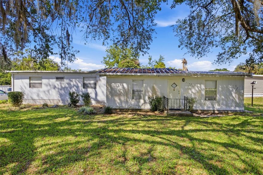 Escape to this charming, single-story home nestled under mature shade trees in Southgate. Unlike many area parks, you own the land here! This 2BR/2BA home includes a spacious eat-in kitchen, formal dining area, and an expansive enclosed Florida room for enjoying the year-round sunshine. The property is well-positioned for quick access to Ocala’s southwest services, urgent care, and fire rescue. This home is turn-key and move-in ready with a minimal $50/year association fee. Don't miss this affordable real estate opportunity!