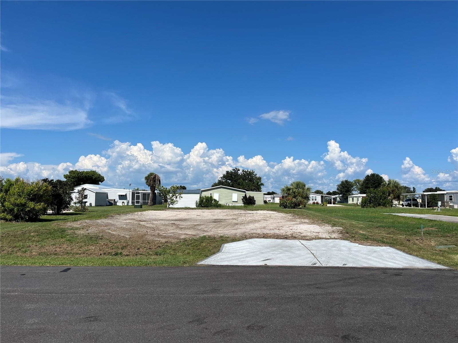 Welcome to your opportunity to own a vacant lot in the desirable 55+ Holiday Mobile Estates community in Englewood, Florida. With the previous home already removed and water, sewer, and electric available at the property line, you’ll save on impact fees when placing your new manufactured home. This well-established neighborhood offers a peaceful, welcoming atmosphere where you can create the Florida lifestyle you’ve always envisioned. Optional membership in the Edgewater Club gives you access to a heated pool, pickleball, and a variety of social activities. Just minutes from Gulf beaches, charming Dearborn Street, shopping, dining, and marinas, this lot offers the perfect blend of convenience, community, and coastal living.
