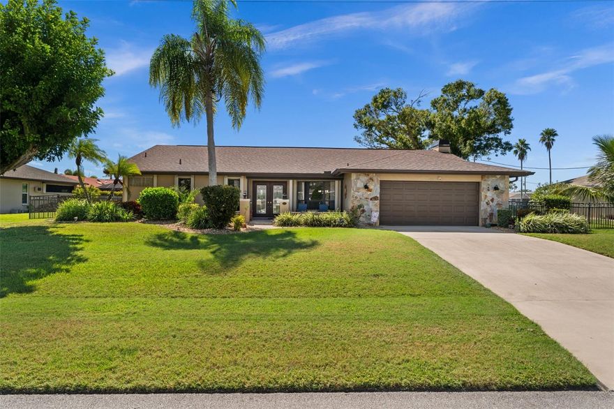 Better Than New! Designer-Renovated Pool Home with Canal Views. This 2,700 SF pool home is perfectly positioned on a quiet street, on an oversized lot, with breathtaking views of intersecting of the Borgia and Bush freshwater canals in Cape Coral, FL. 
Perfect for entertaining, or ideal for a growing family, this home has been well-loved and completely renovated with high-end designer upgrades by a well-respected, local, custom builder | remodeler. “Pristine” and “move-in ready” are truly taken to a new level. From the moment you arrive, you’ll be impressed by lush tropical landscaping, a crafted stone lanai, and an elegant double-door entry. Step inside and you’ll immediately notice the thoughtful, “no-detail-spared" design. The eat-in kitchen boasts granite countertops, stainless steel appliances, abundant cabinetry, and convenient access to the large dining room. The spacious living room showcases incomparable views of the canal system and seamless access to the pavered pool deck. For gatherings, the 18’ x 15’ family room is sure to impress - complete with a soaring wood ceiling, architectural wood beams, and a custom, floor-to-ceiling stone fireplace and hearth. The 12’ x 12’ den provides flexibility and could readily serve as a home office, a craft room, a quiet reading nook, or a fourth bedroom. The oversized primary suite (24’ x 14’) offers private pool access and a fully remodeled en-suite bath. Privacy abounds with a split floor plan, and the second and third bedrooms are generously sized. The screened lanai and sparkling pool can be accessed from the primary suite, living room, and kitchen - making indoor | outdoor living effortless.
Additional Updates, Features & Enhancements: AC – 2025 | Roof - 2023 | Electrical Panel - 2024 | Leaf Filter Gutter Guards - 2022 | Solar Pool Heater - 2020 | Chimney - 2020 | 4’ Aluminum Fence - 2019 | Oversized TREX Dock - 2016 | Whole Home Hurricane Protection - 15 Accordion shutters, Electric Roll-Downs, 4 Lexan Panels) | Whole Home Brinks Security System | Solar Tube Lights in Kitchen | Solar Attic Fan | Oversized 472 SF Garage | No Carpet - Tile & Engineered Hardwood Throughout
Location, Location, Location: Conveniently situated in the Del Prado Boulevard | Pine Island Road corridor, you’ll be close to schools, shopping, dining, and golf courses, and the Cape Coral Hospital. This home isn’t just renovated—it’s transformed into a showplace. Schedule your private tour today and experience Florida living at its finest. Best of All—No Flood Insurance Required!