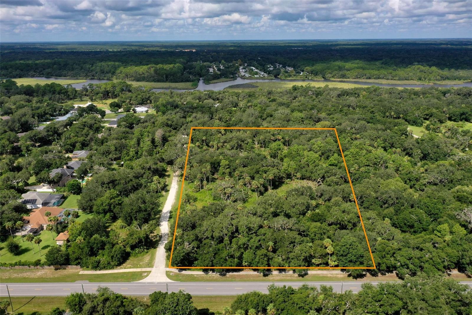 Waterfront and equestrian lifestyle with your own private boat slip.
Located in Flagler Beach within the private gated community of Seaside Landings, this seven acre homesite offers privacy, space, and coastal living. Your deeded 25 foot boat slip is just steps away, providing quick access to the Intracoastal Waterway and the scenic Matanzas River for cruising and fishing.
Design and build your custom home with room for a stable, a riding arena, gardens, and additional outbuildings, subject to approvals. The setting is framed by the natural beauty of Bulow Creek State Park along picturesque John Anderson Highway.
A short drive places you in the heart of Flagler Beach with miles of sandy shoreline, oceanfront parks, local shops, and relaxed coastal dining. Waterfront dining along the Intracoastal is close by, as are multiple golf courses, parks, and trails. Palm Coast Town Center is also nearby for additional shopping, dining, and entertainment.
Underbrush has been cleared and a bore test indicates acceptable soils, allowing you to move forward with confidence.
The property boundaries shown are for illustration only and may not reflect the exact legal property lines. All dimensions are approximate and should be verified by a licensed surveyor.
